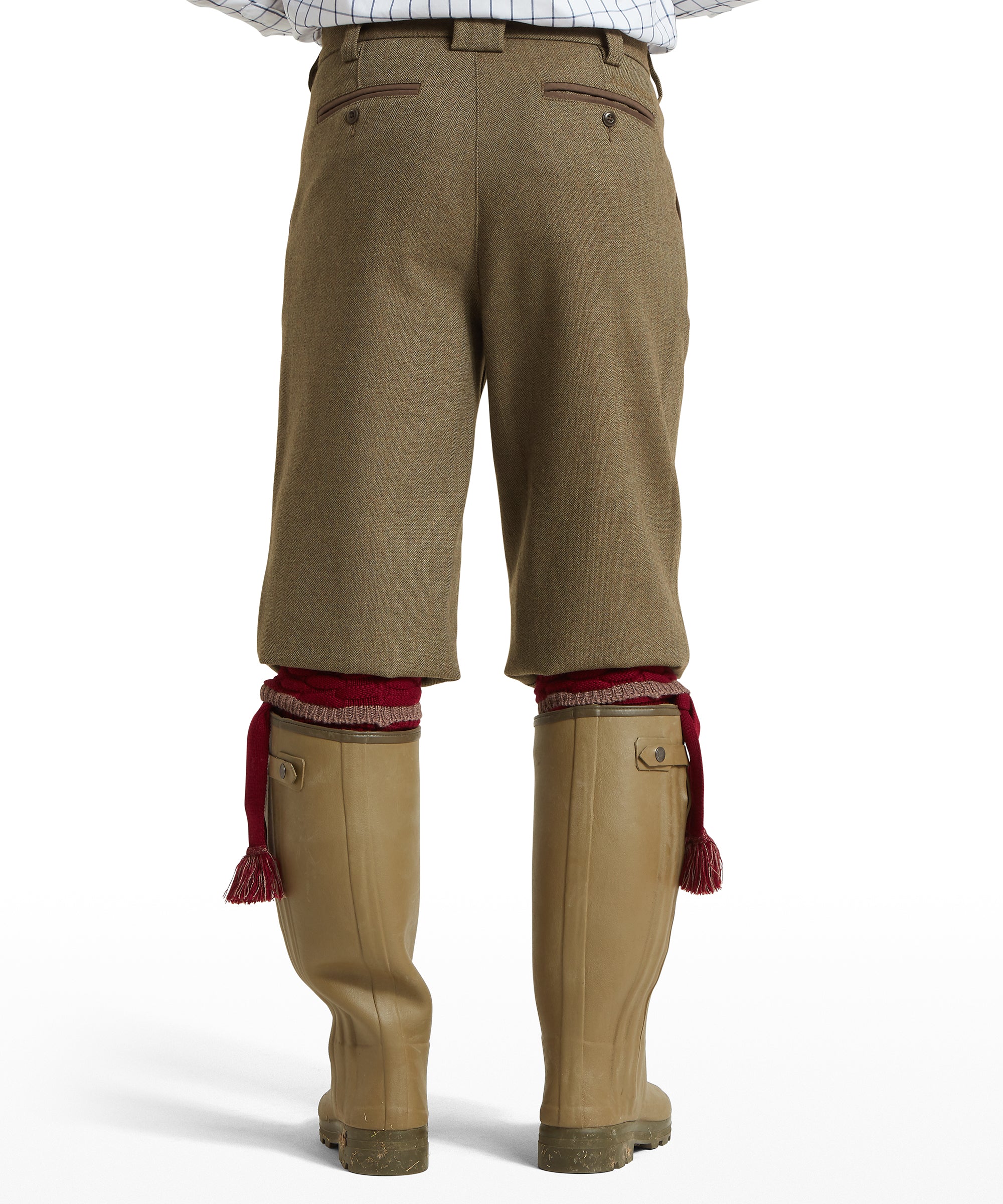 Tan herringbone tweed shooting breeches with red knitted cuffs featured in tweed plus fours loden