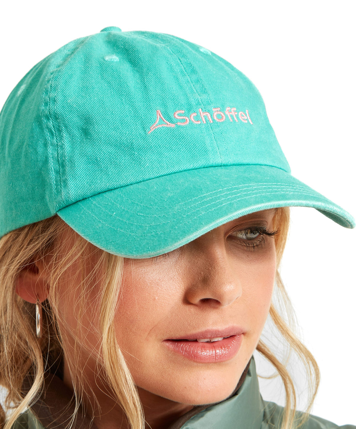 A teal cotton thurlestone cap with a subtle pink embroidered schöffel logo perfect for casual wear