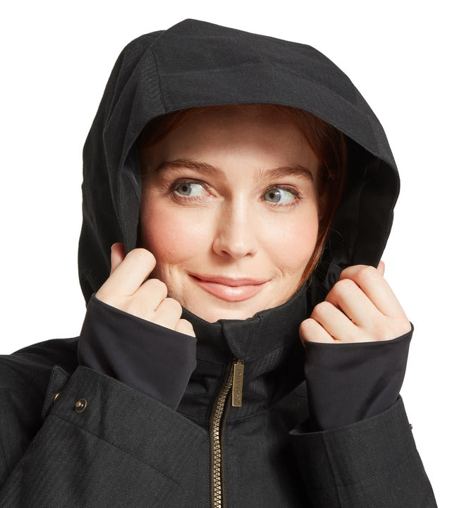 Schöffel Allexton waterproof coat in grey, close-up of woman pulling up hood with contrast trim and full-length zip