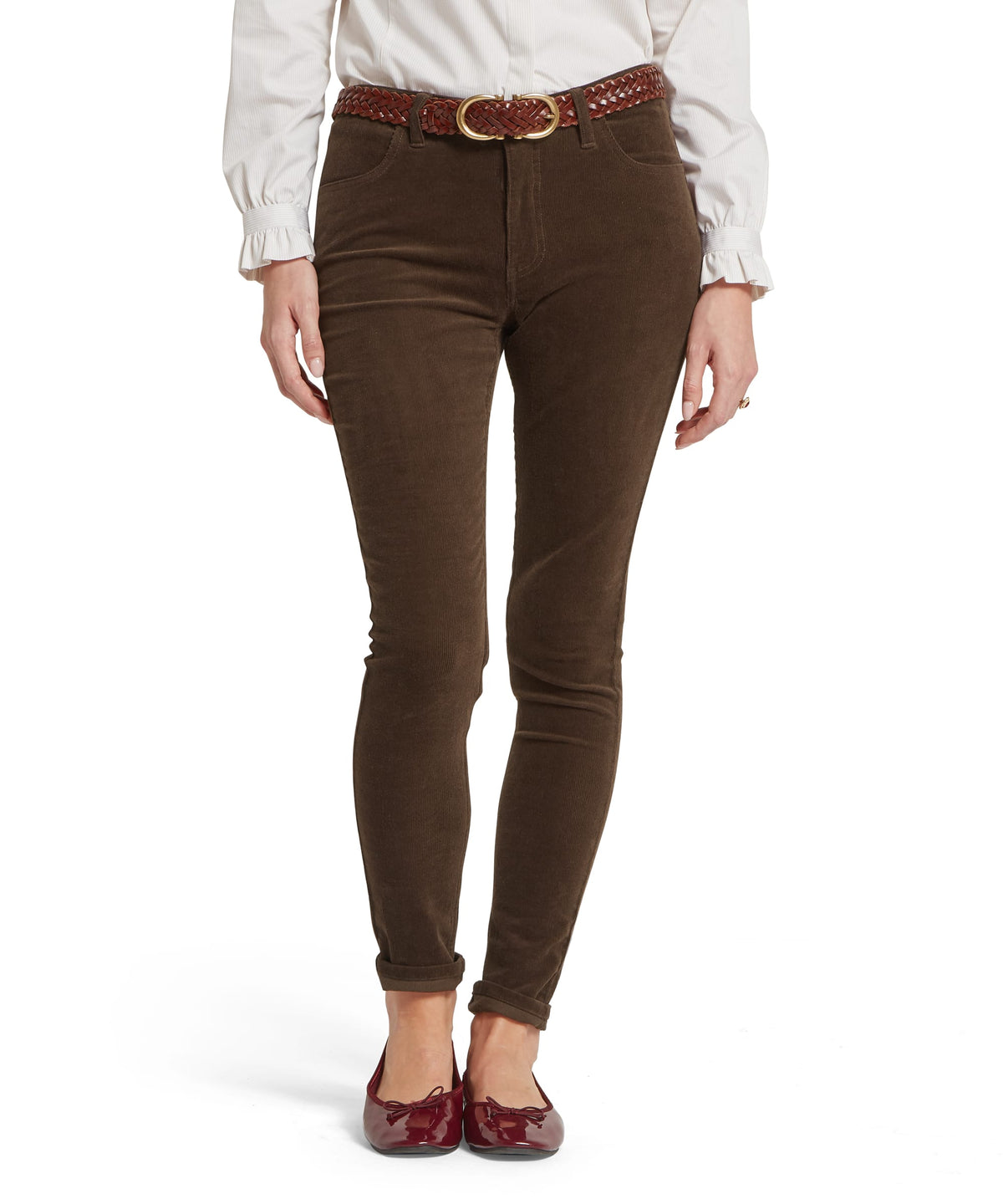 Brown velvet skinny clover cord jean in chocolate with high waist and rolled cuffs shown from