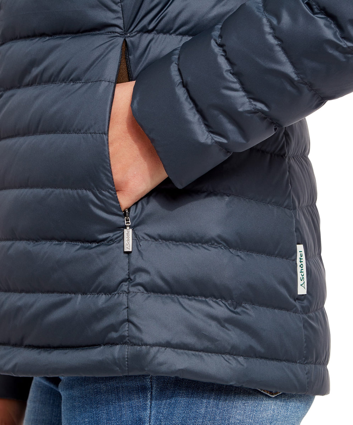 Dark blue quilted hambleton down jacket with zipper pocket and brand tag in petrol blue color