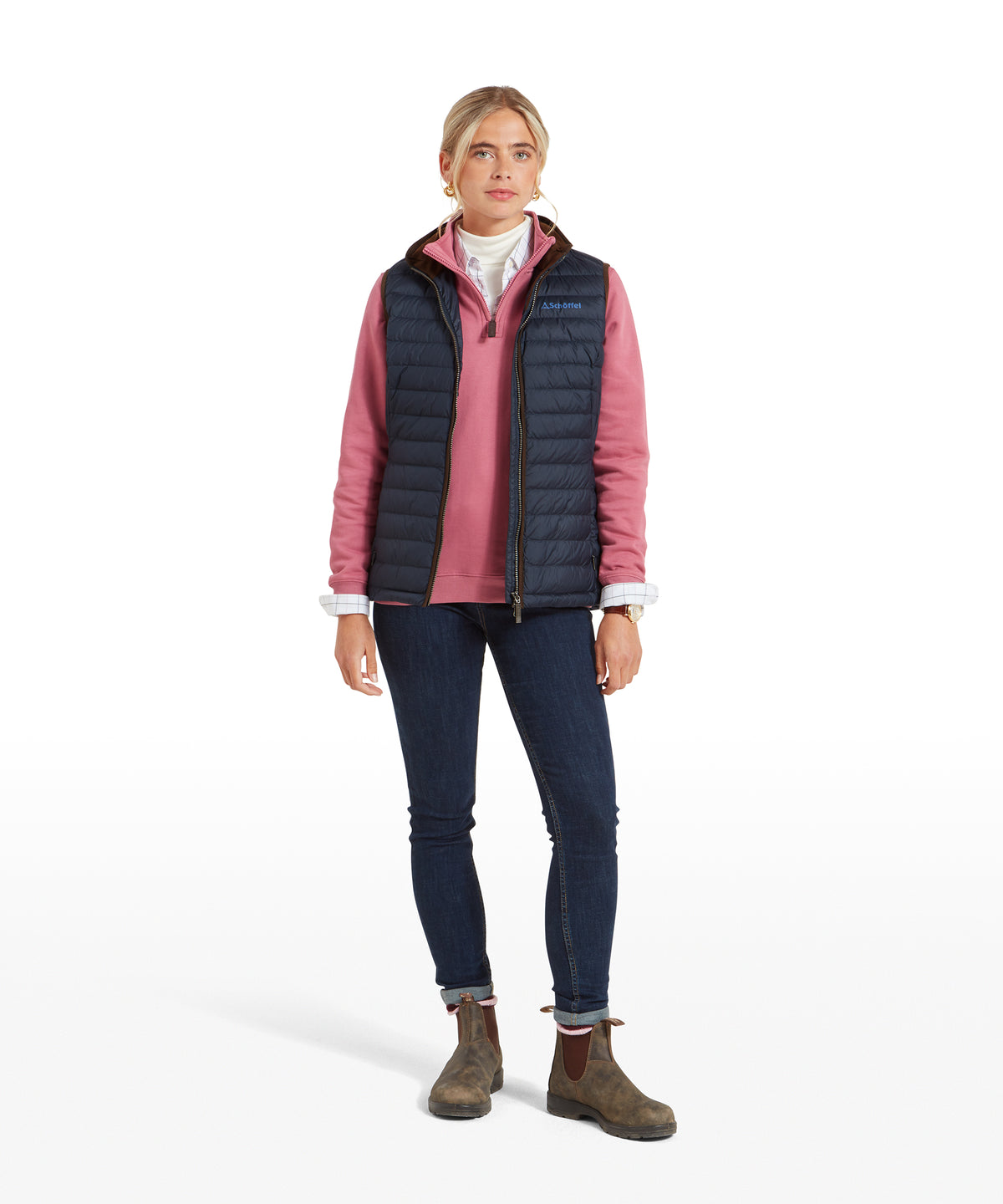 Navy blue quilted polyester Launde Down Gilet worn over a pink long-sleeved shirt for casual