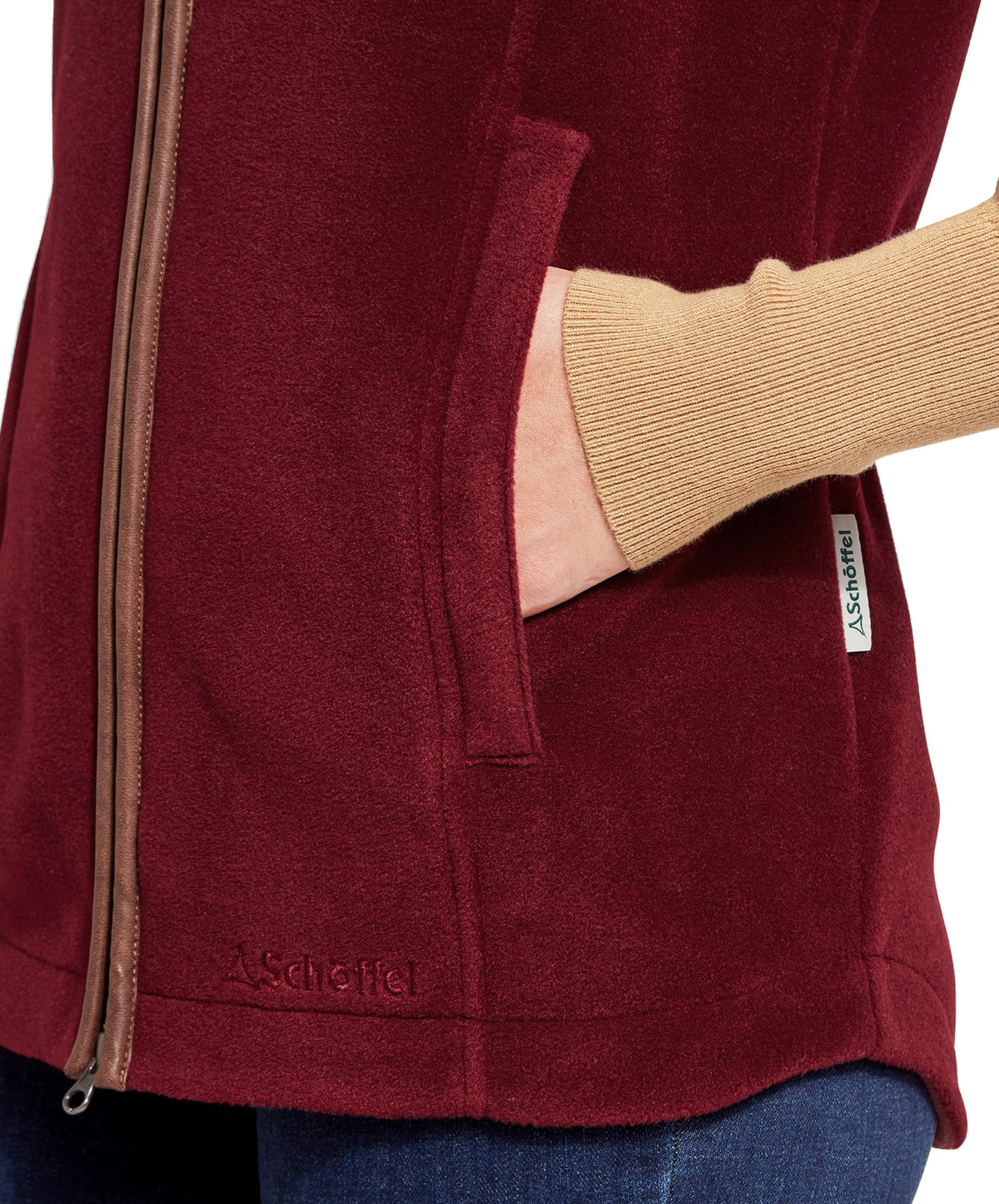 Maroon fleece vest with brown zipper and brand tag from the lyndon fleece gilet claret collection