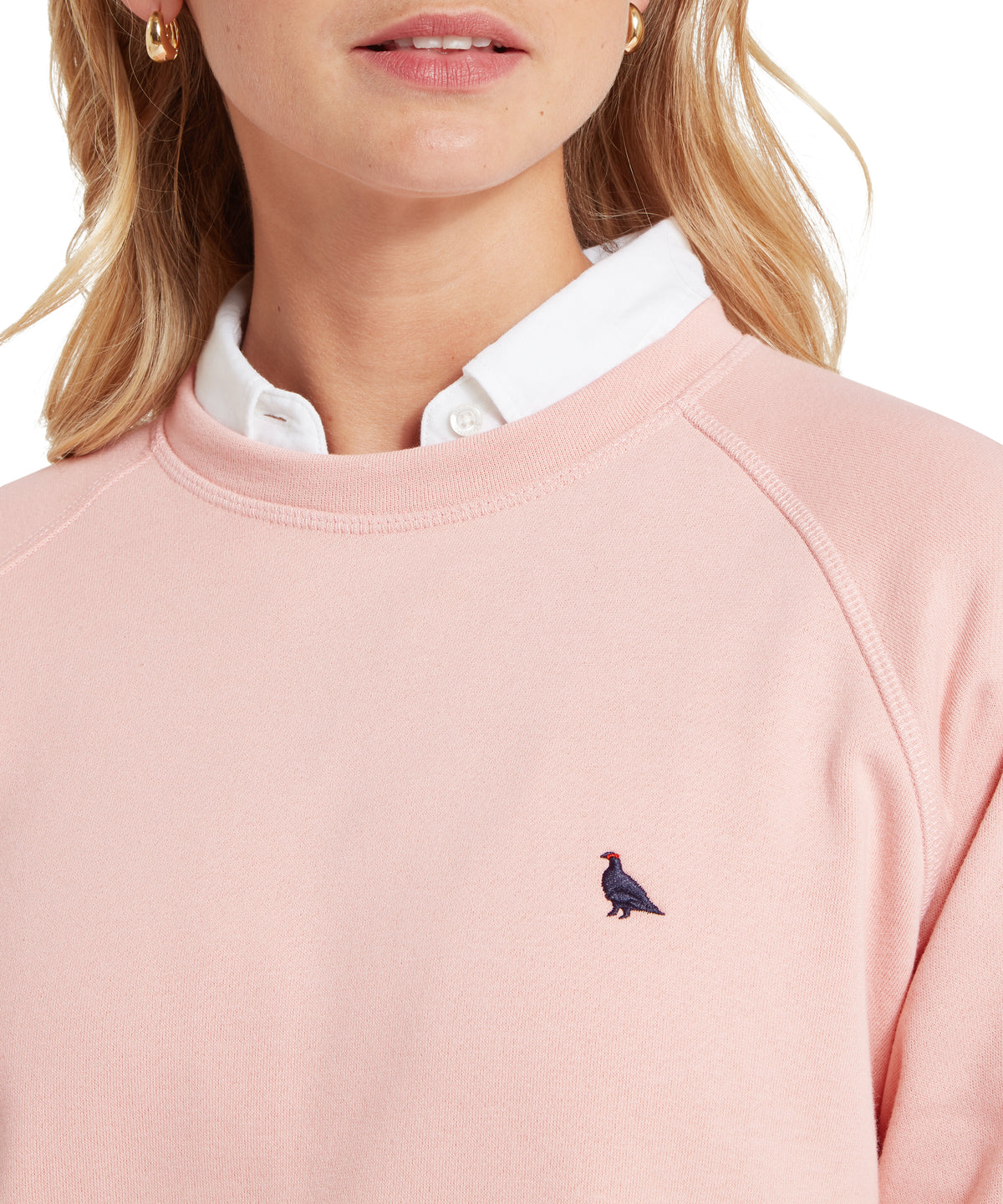 Pink crewneck sweatshirt newberry sweatshirt pale rosé with small embroidered bird logo on the chest
