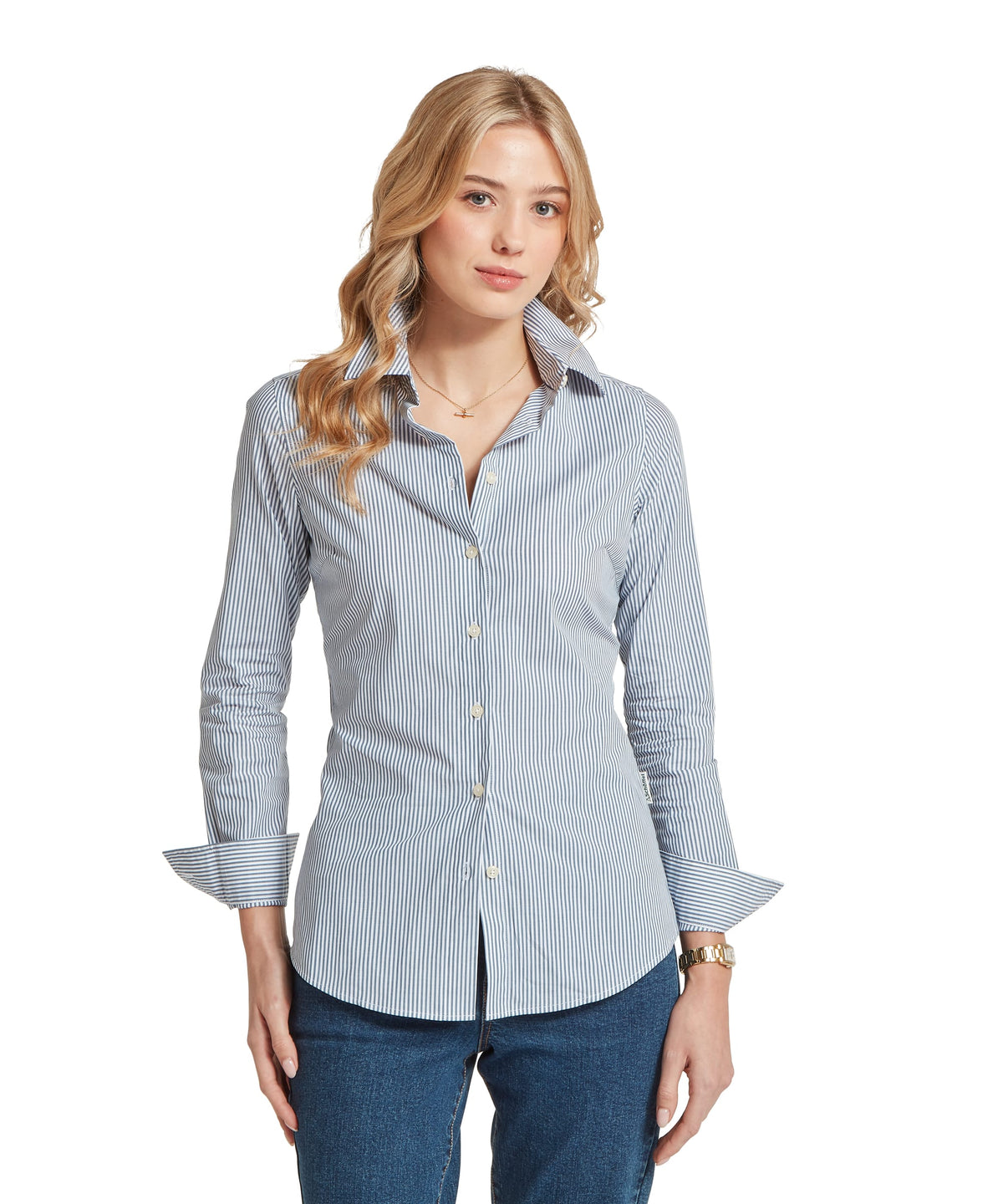 A classic women’s long-sleeved button-down Norfolk shirt in crisp blue and white vertical stripes