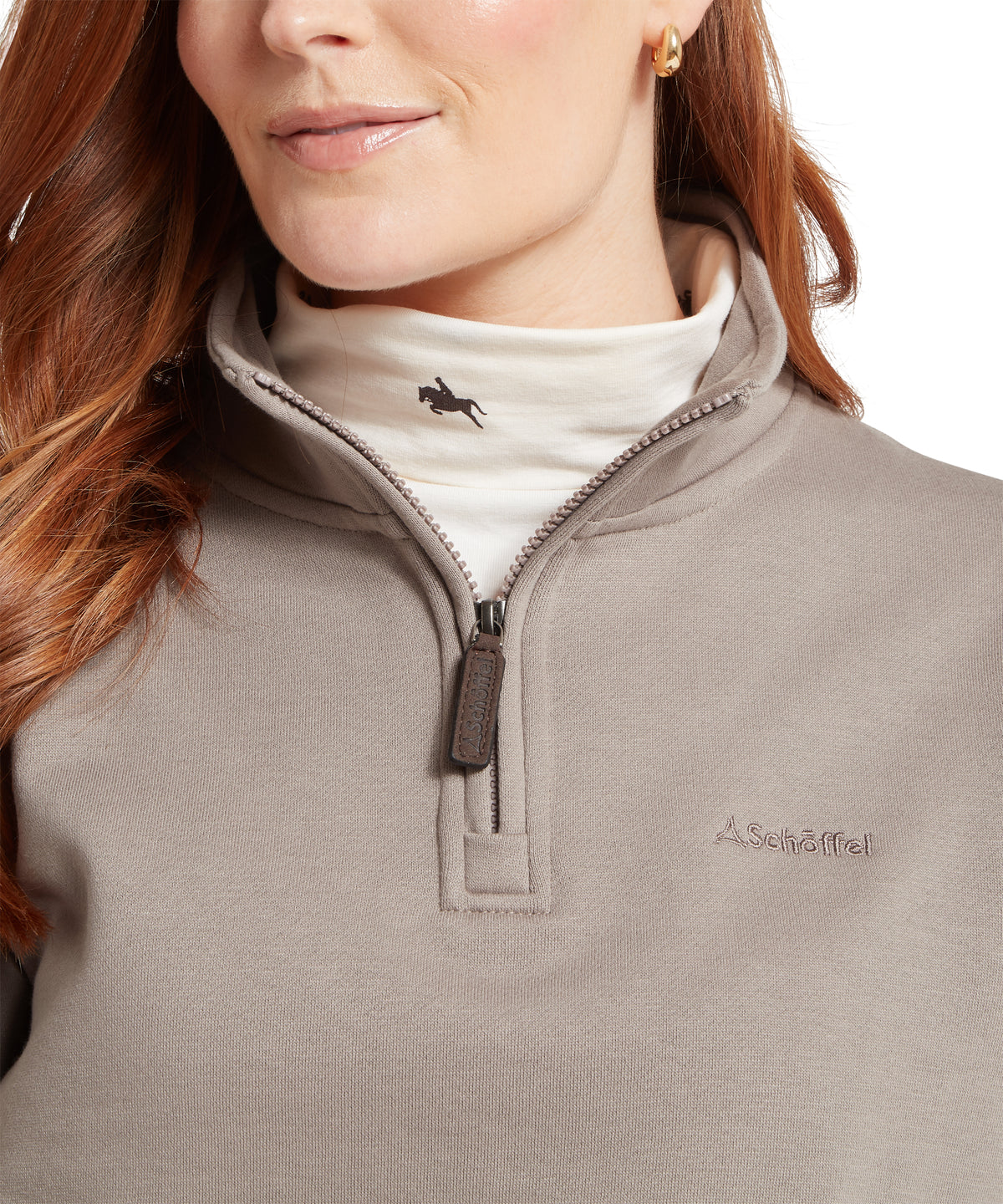 A taupe quarter-zip fleece sweatshirt with subtle chest embroidery and horse silhouette on inner