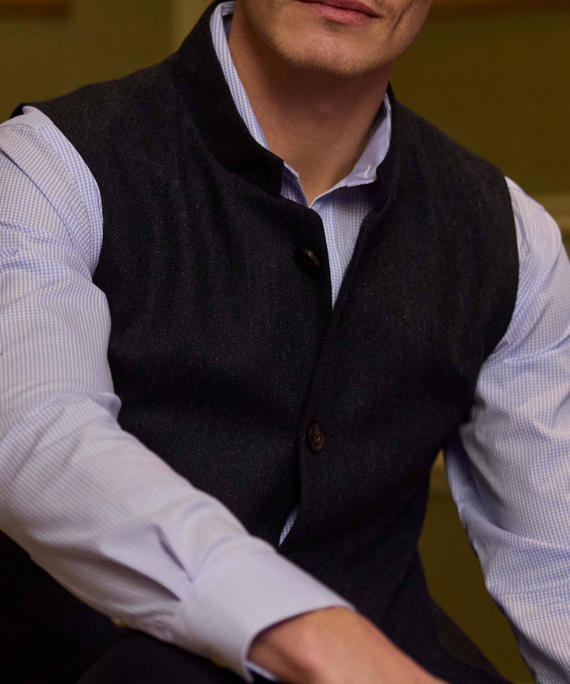 Close-up of the button fastening and stand collar on Schöffel Country's charcoal wool gilet