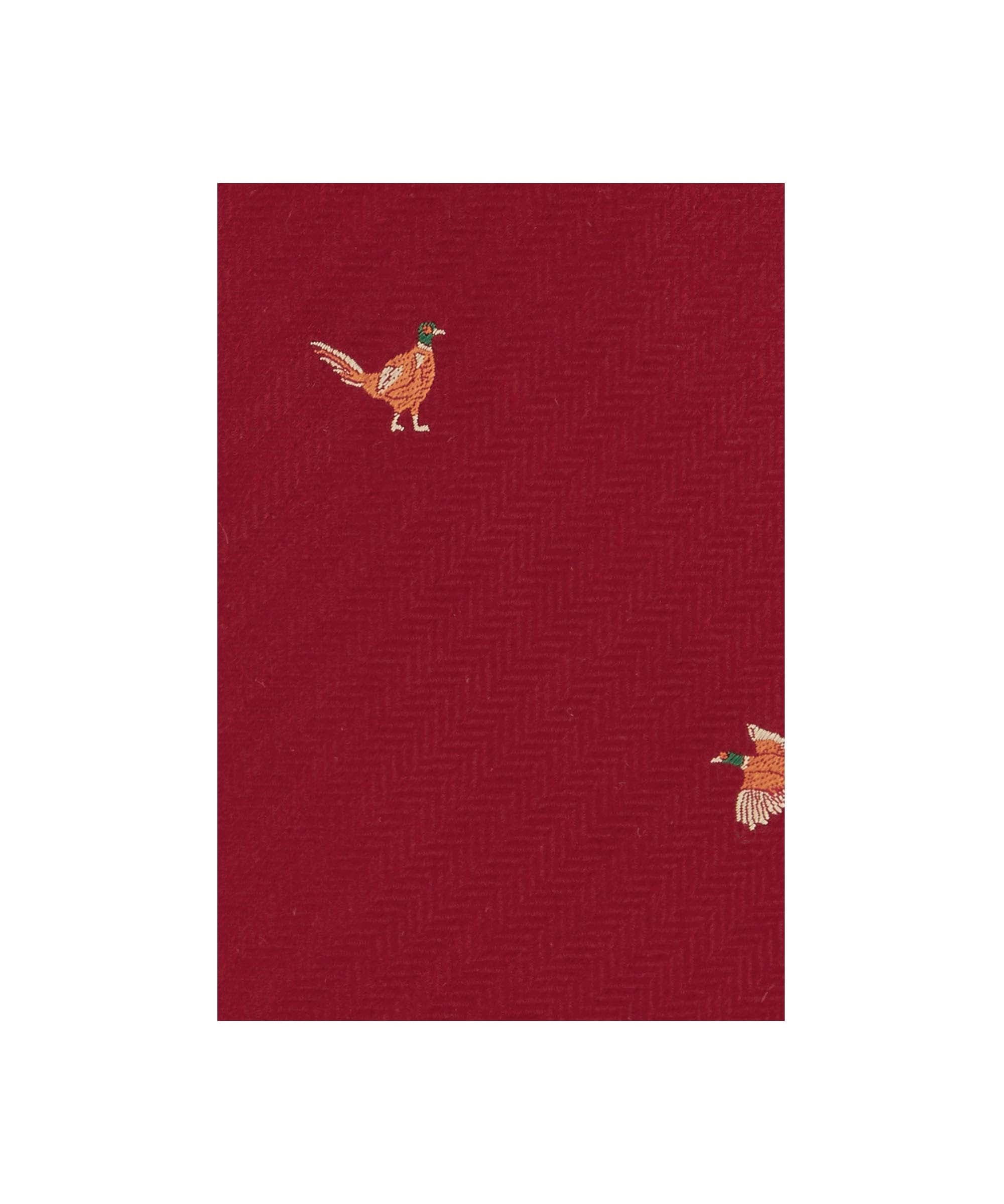 Schöffel Men's Silk Tie in Red with embroidered pheasant and mallard duck pattern on herringbone ground close-up detail
