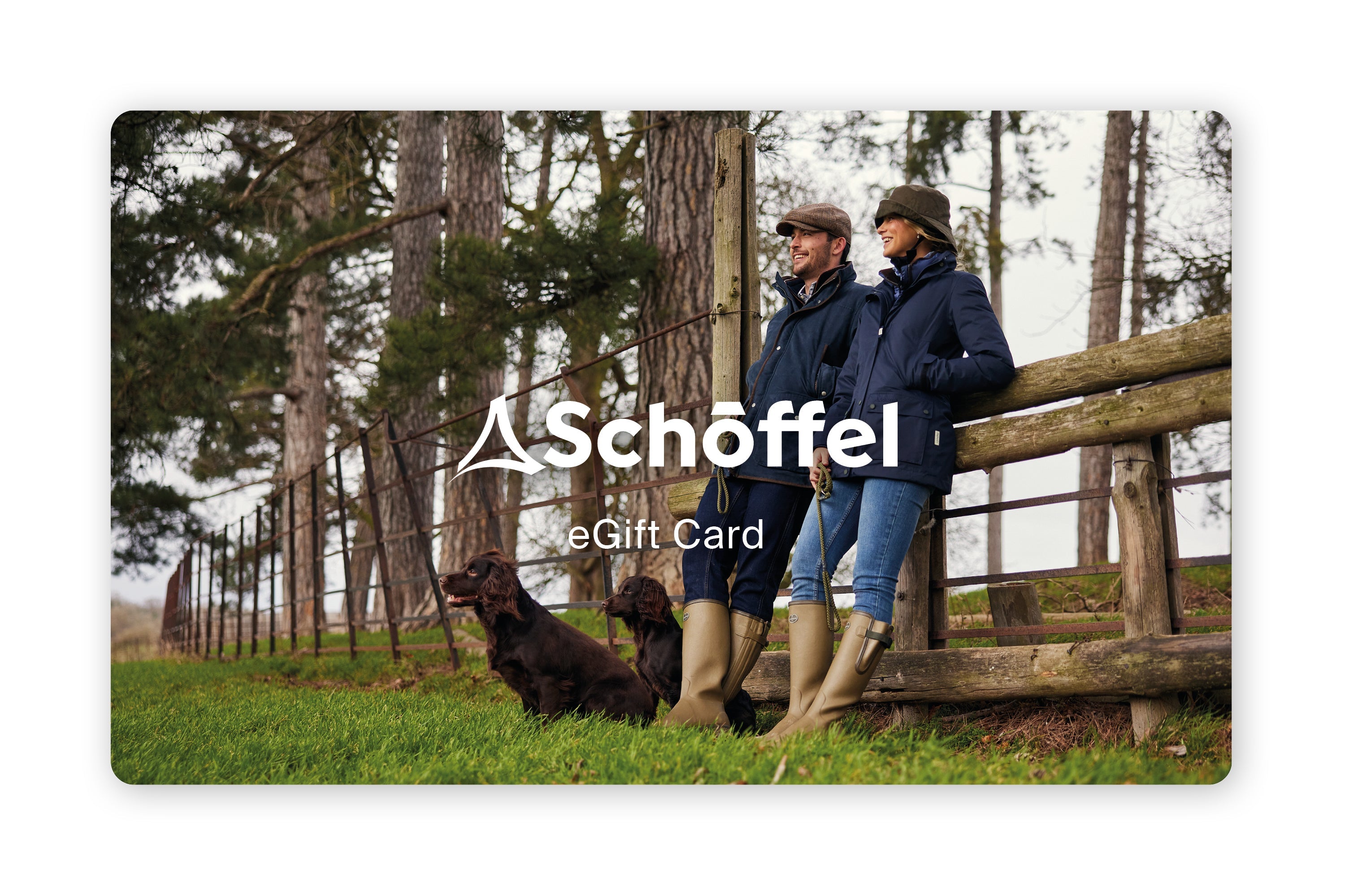 Schoeffel eGift Card with two people and a dog by a wooden fence in a forest setting.