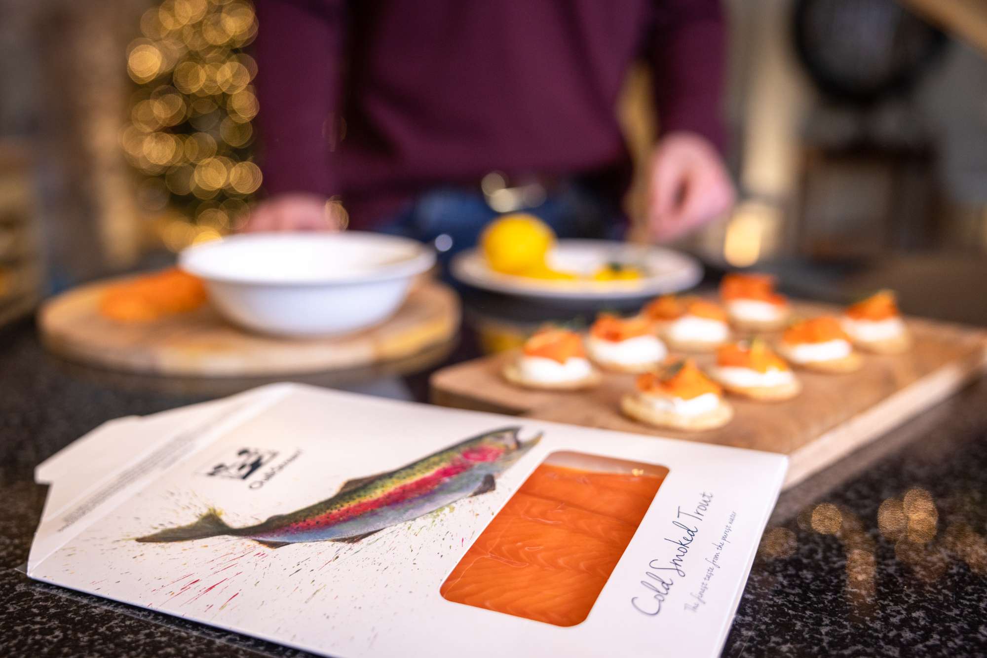 Smoked salmon and canapes laid out on a worktop.