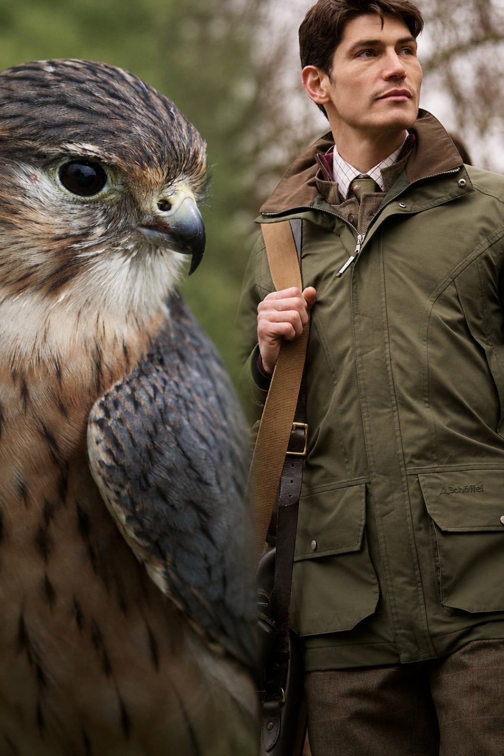 A man in an olive green hunting jacket next to an image of a large falcon