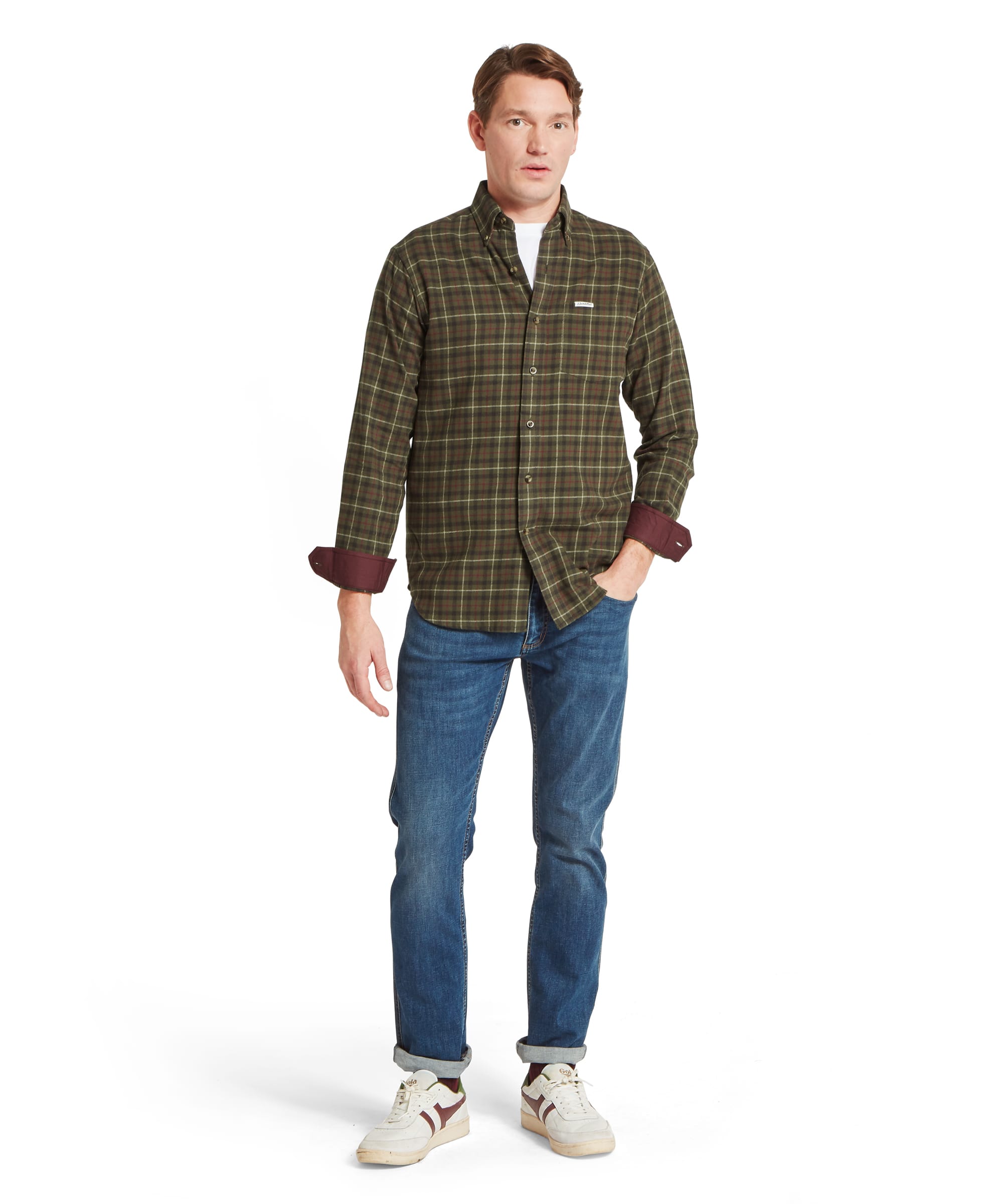 Schöffel Men's Akenham Shirt in Green - three-quarter front view of a relaxed-fit olive tartan flannel shirt with button-down collar and burgundy wax cotton cuffs, paired with blue jeans.