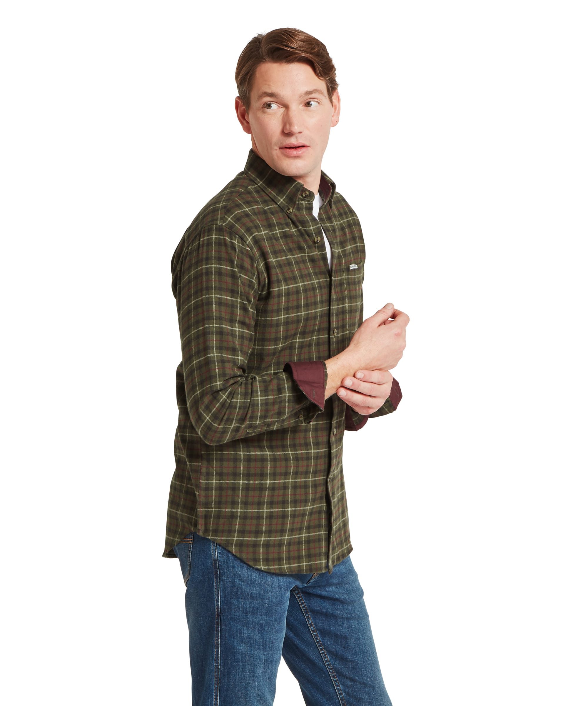Close-up detail of the Schöffel Men's Akenham Shirt in Green, highlighting the olive and rust tartan check fabric, button-down collar, horn-effect buttons, and Schöffel logo badge on the chest pocket.
