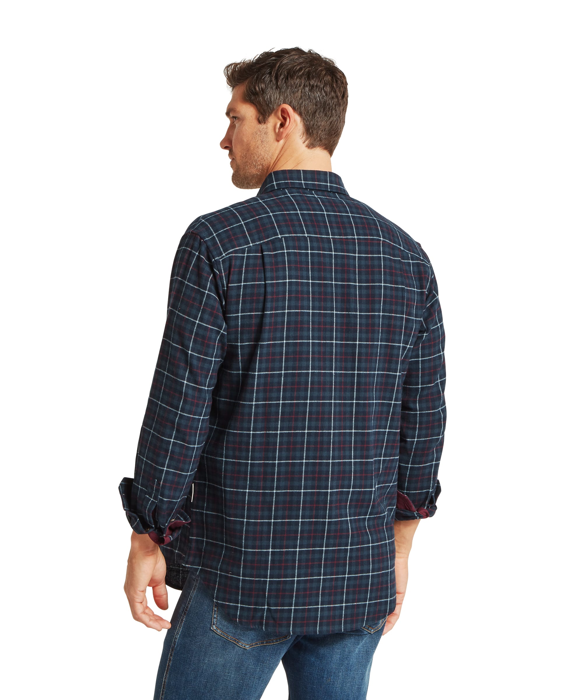 Schöffel Men's Akenham Shirt in Blue - full-length front view worn open over a white T-shirt with jeans and Adidas Gazelle trainers, showing the relaxed country silhouette and rolled burgundy cuffs.