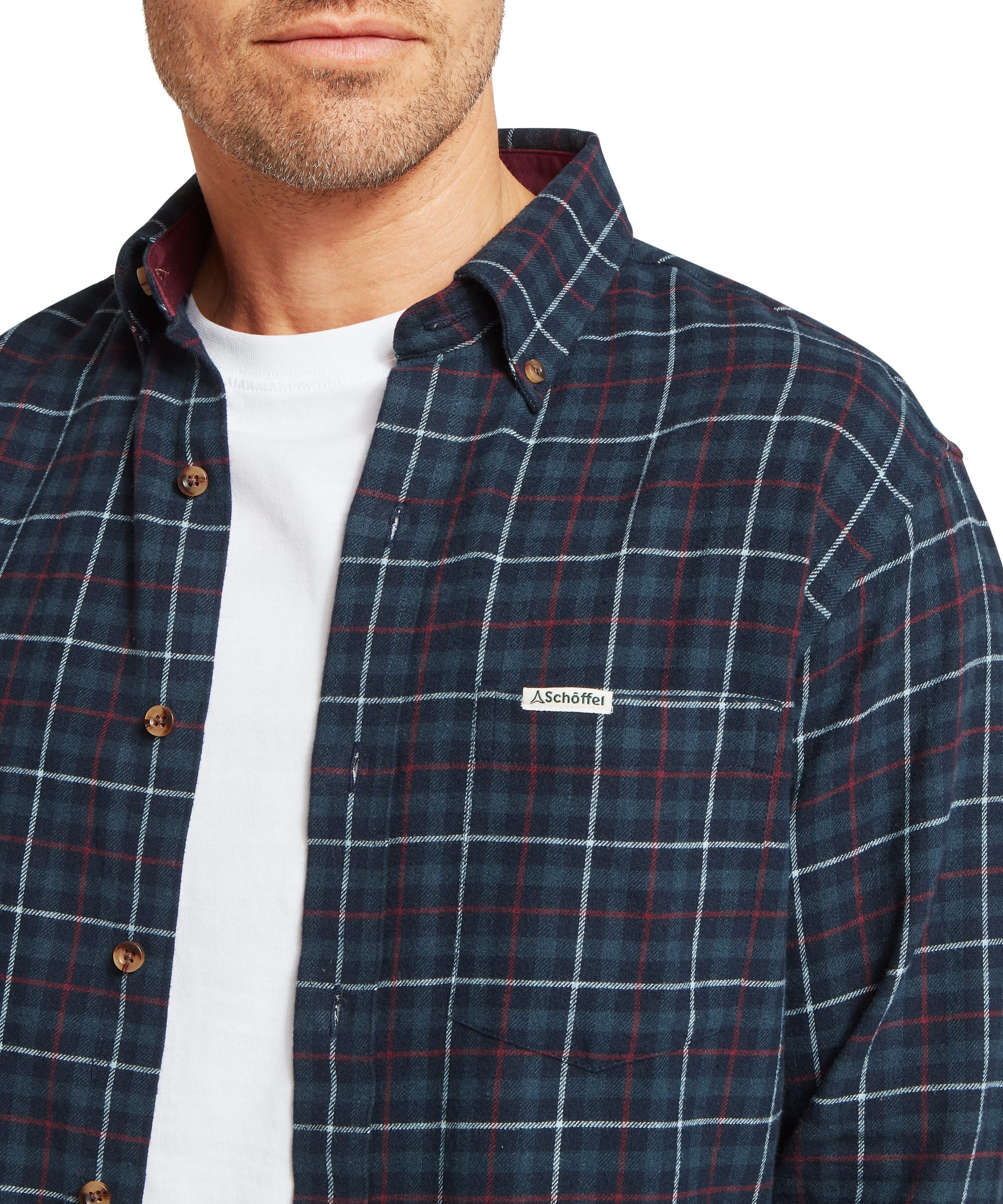 Schöffel Men's Akenham Shirt in Blue - three-quarter side view of the navy tartan flannel shirt worn open and relaxed, highlighting the deep windowpane check and contrast burgundy wax cotton cuff lining.