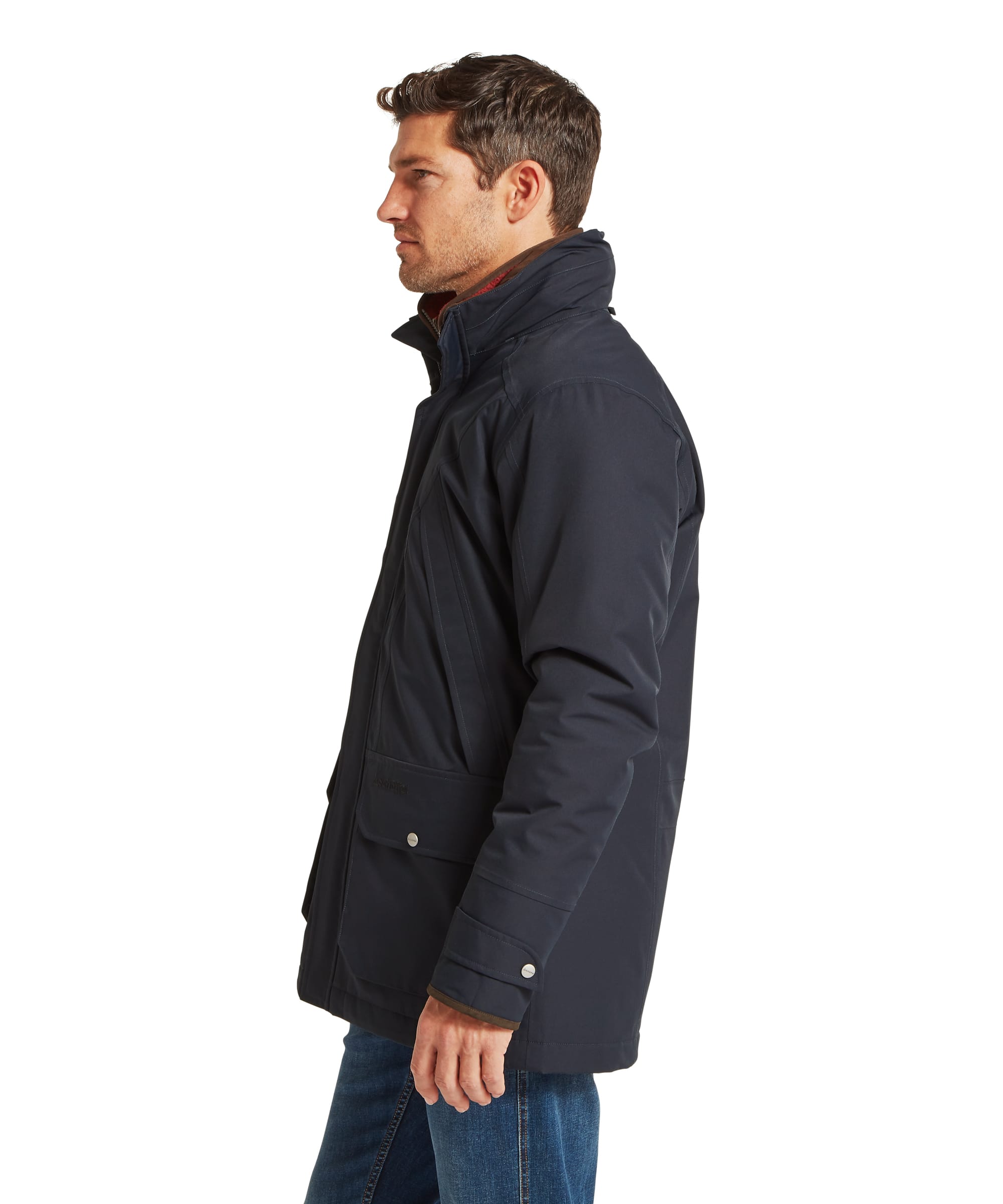 Close-up collar detail of the Schöffel Men's Barrow Country Coat in Navy, showing the storm collar with wax cotton inner lining, main zip fastening, and snap stud closures layered over a fleece midlayer and tartan shirt.