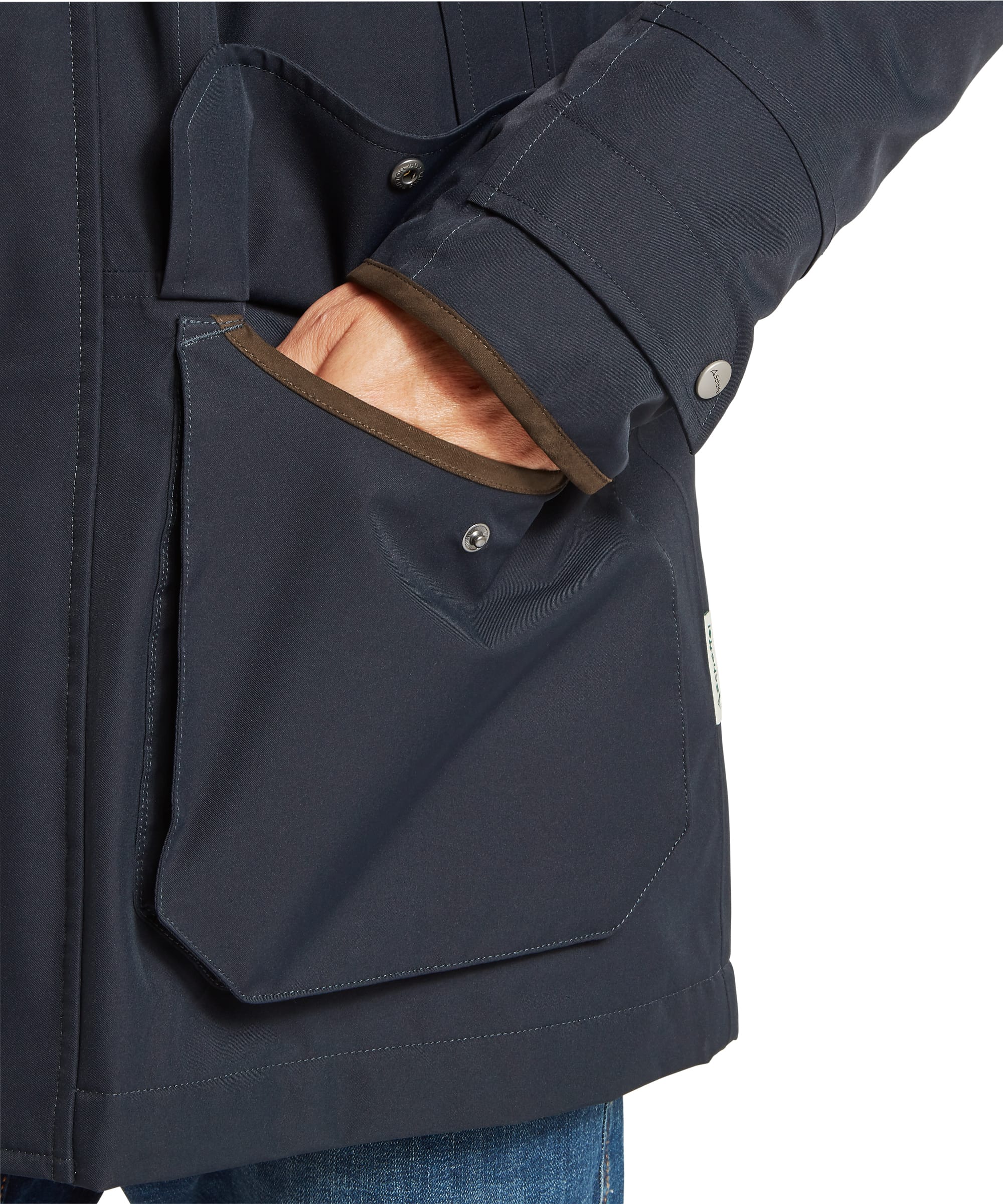 Close-up cuff detail of the Schöffel Men's Barrow Country Coat in Navy, highlighting the adjustable press-stud cuff fastening with contrast wax cotton inner trim and Schöffel branded snap button.