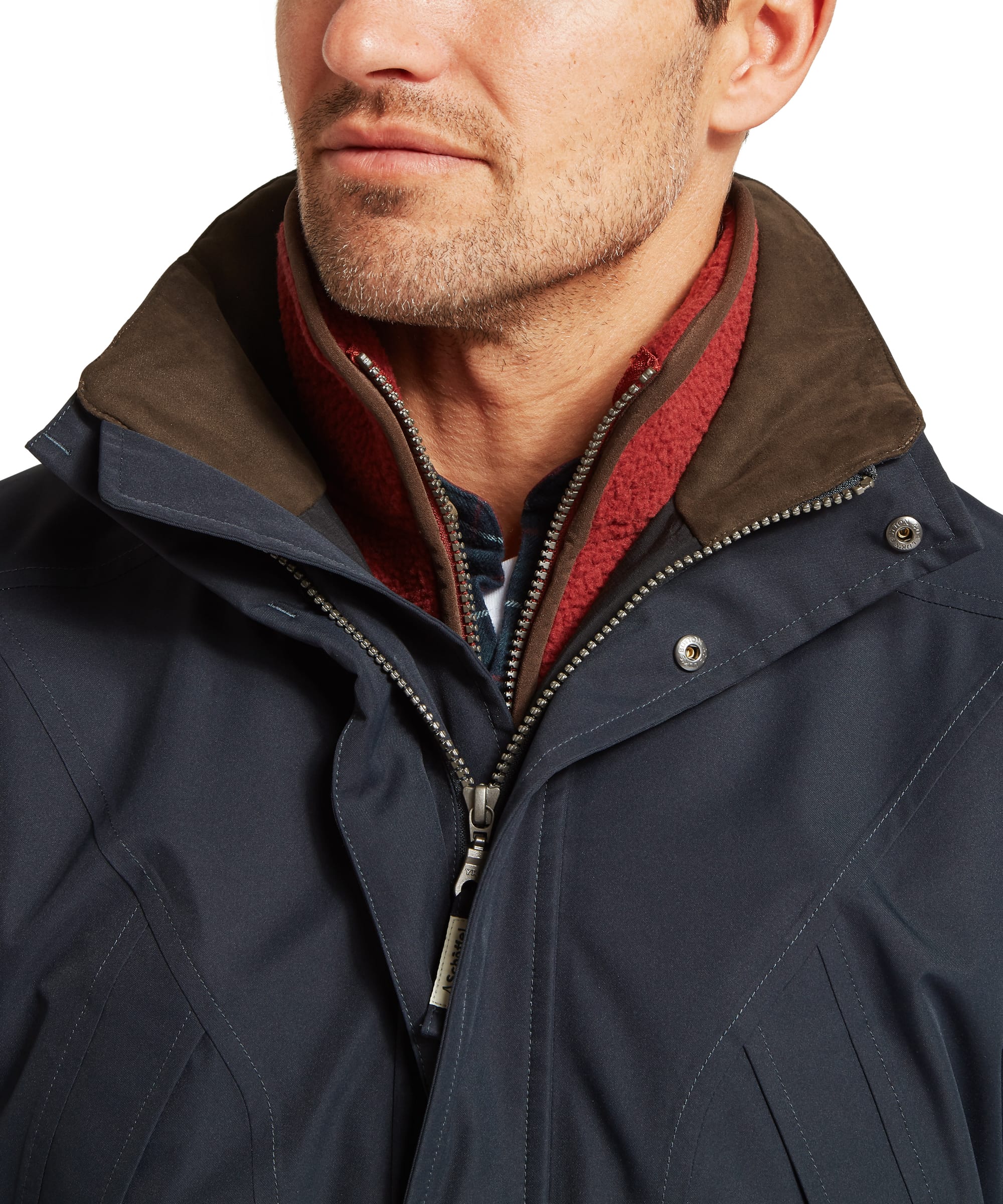 Schöffel Men's Barrow Country Coat in Navy - close-up of the attached waterproof hood deployed, showing the structured navy shell fabric and adjustable fit, with layered inner collar visible below.