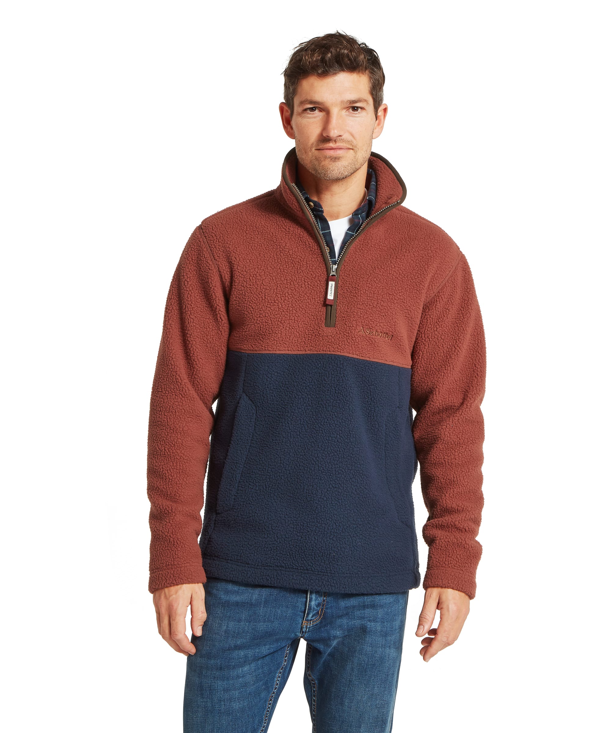 Schöffel Men's Berkeley Retro Fleece in Brown - front view of a colour-block quarter-zip sherpa fleece in rust brown and navy, with a funnel neck collar, kangaroo-style hand pocket, and Schöffel chest logo, worn with jeans and a check shirt.