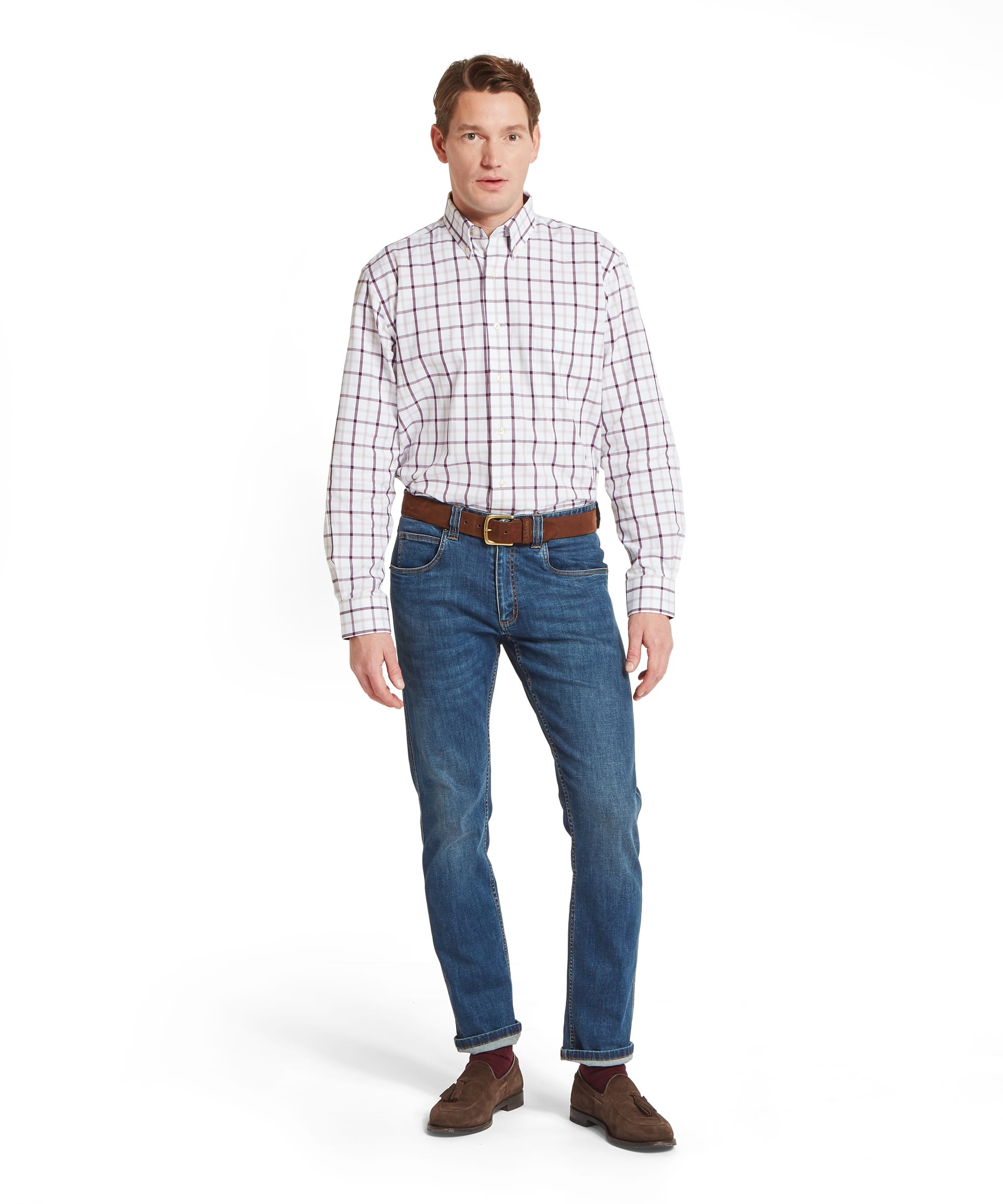 Schöffel Men's Brancaster Classic Shirt in Red - full-length front view of the classic-fit white windowpane check shirt worn tucked into blue jeans with a tan leather belt and brown suede tassel loafers.
