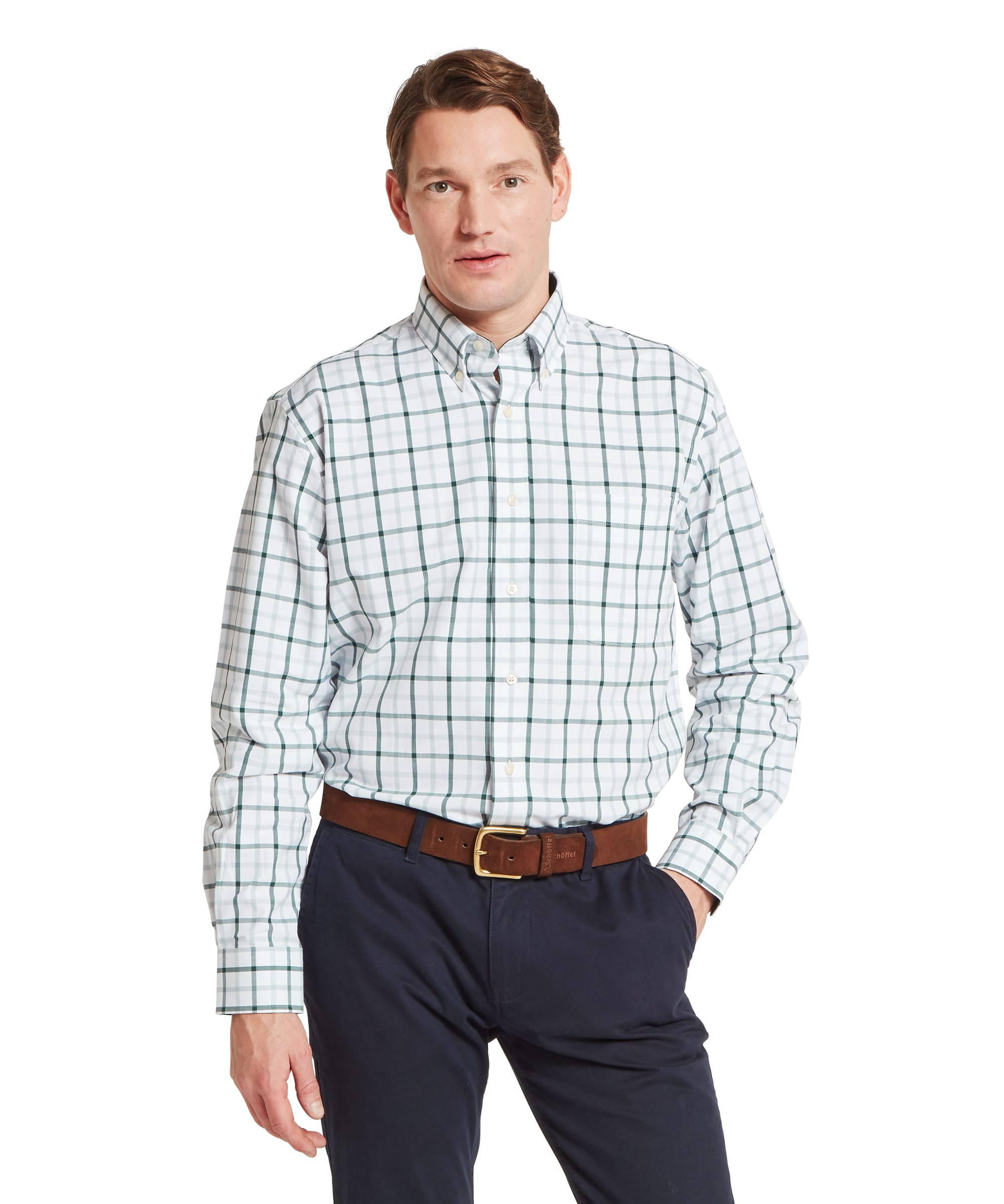 Schöffel Men's Brancaster Classic Shirt in Green - front view of a classic-fit white ground shirt with a bold green and grey windowpane check, button-down collar, and chest pocket, worn tucked into navy chinos with a tan leather belt.