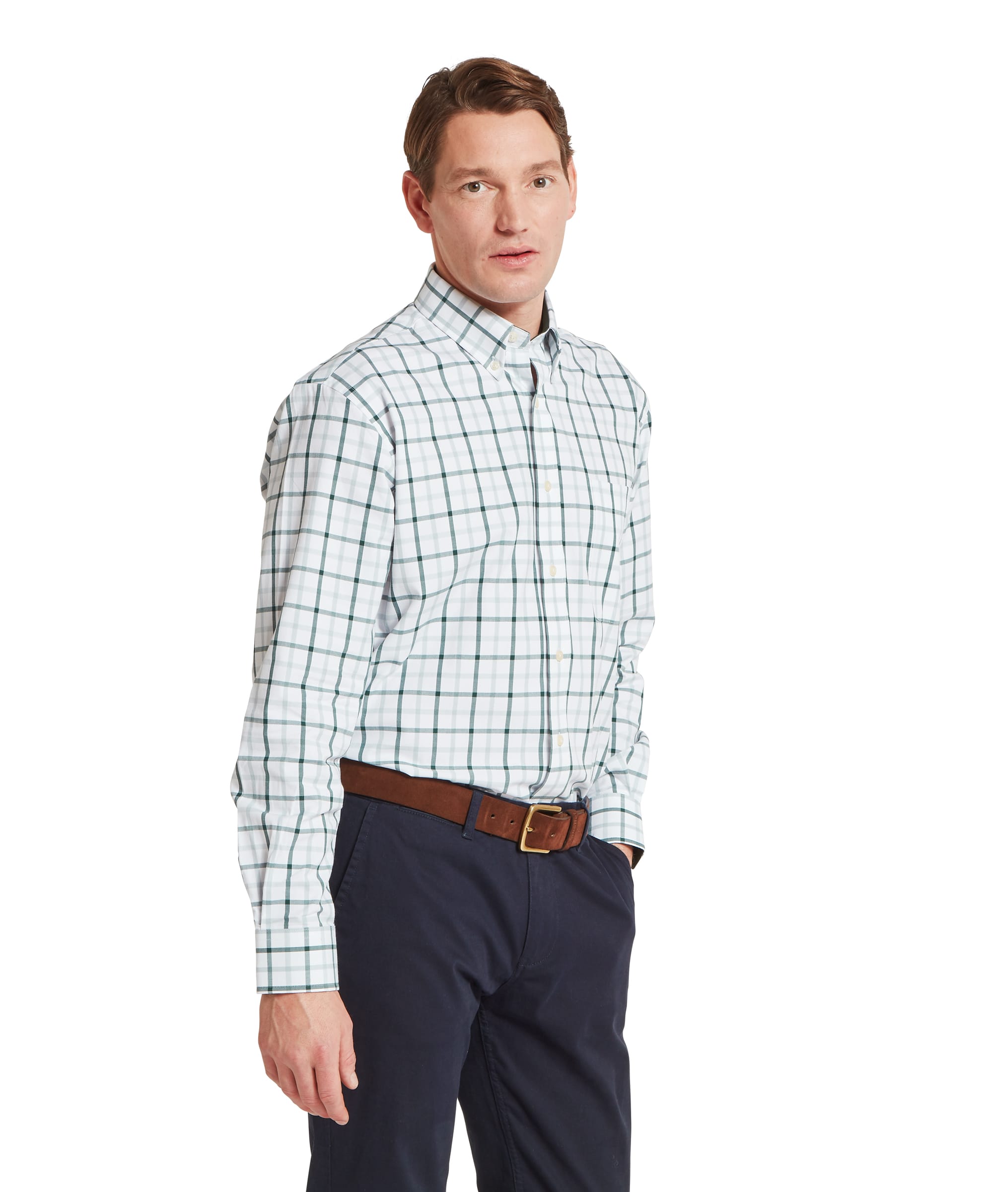 Schöffel Men's Brancaster Classic Shirt in Green - three-quarter front view of the classic-fit white ground green windowpane check shirt, worn tucked into navy chinos with a tan leather belt.