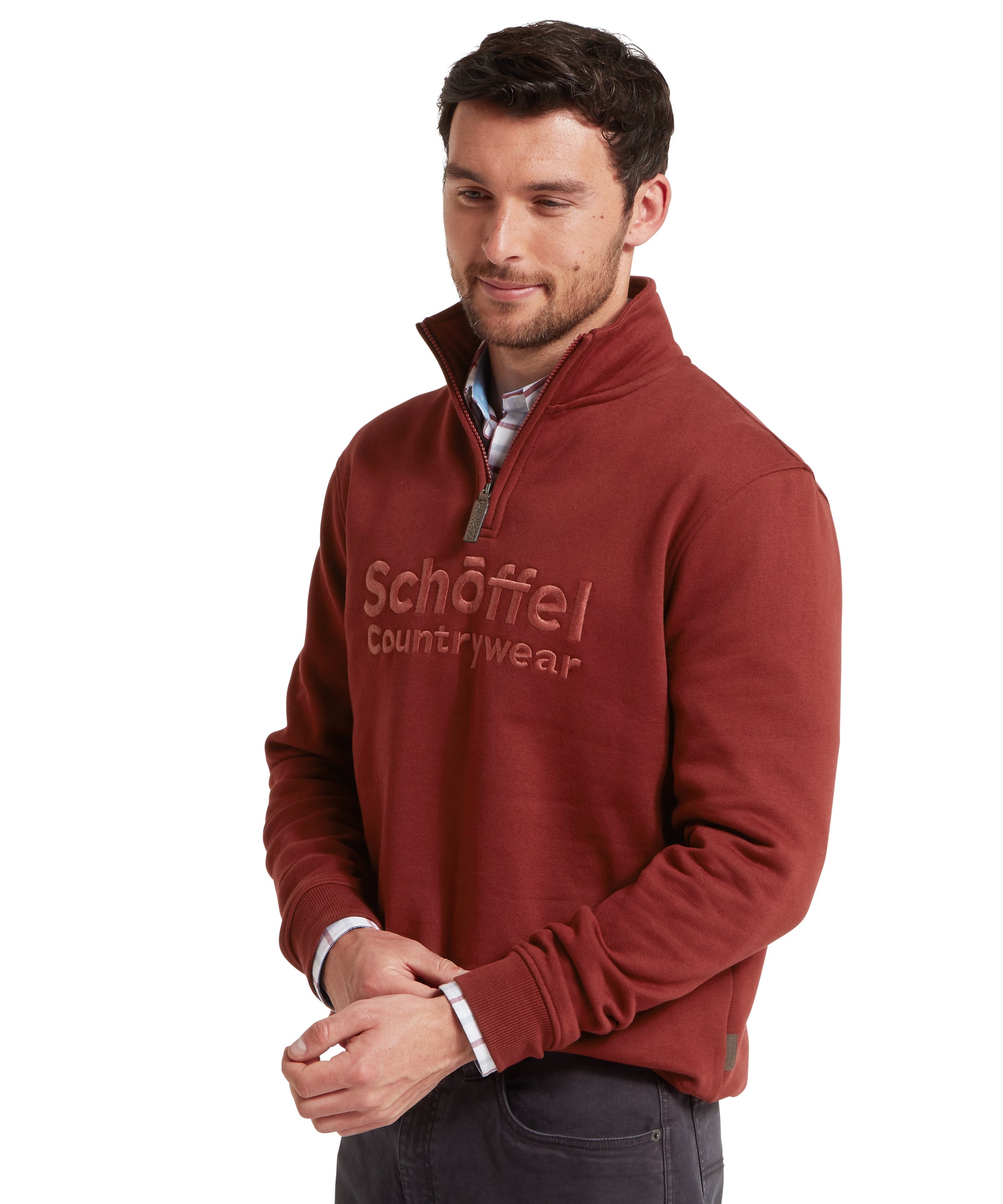 Man wearing a red Schöffel countrywear sweatshirt on a white background