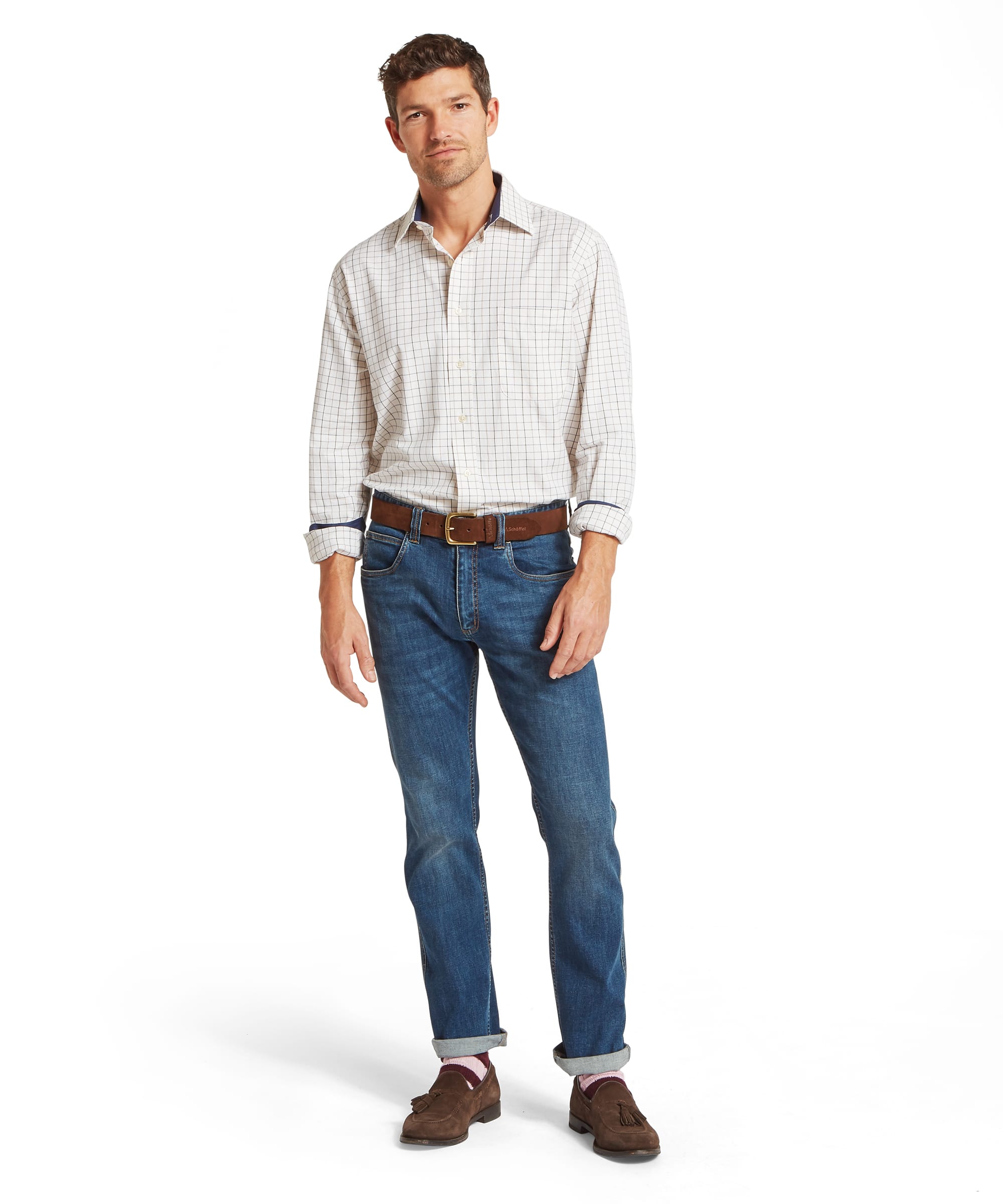 Schöffel Men's Burnham Tattersall Classic Shirt in Blue - full-length front view worn with sleeves rolled to reveal the contrast navy cuff lining, paired with blue jeans, a tan leather belt, and brown suede tassel loafers.