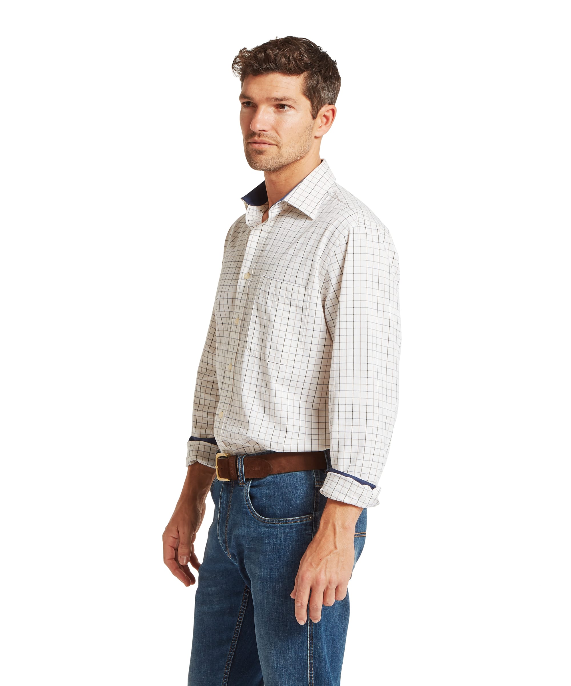 Schöffel Men's Burnham Tattersall Classic Shirt in Blue - three-quarter side view of the fine white ground navy and brown tattersall check classic shirt with a spread collar and contrast navy collar lining, worn with sleeves rolled and jeans and a tan belt.