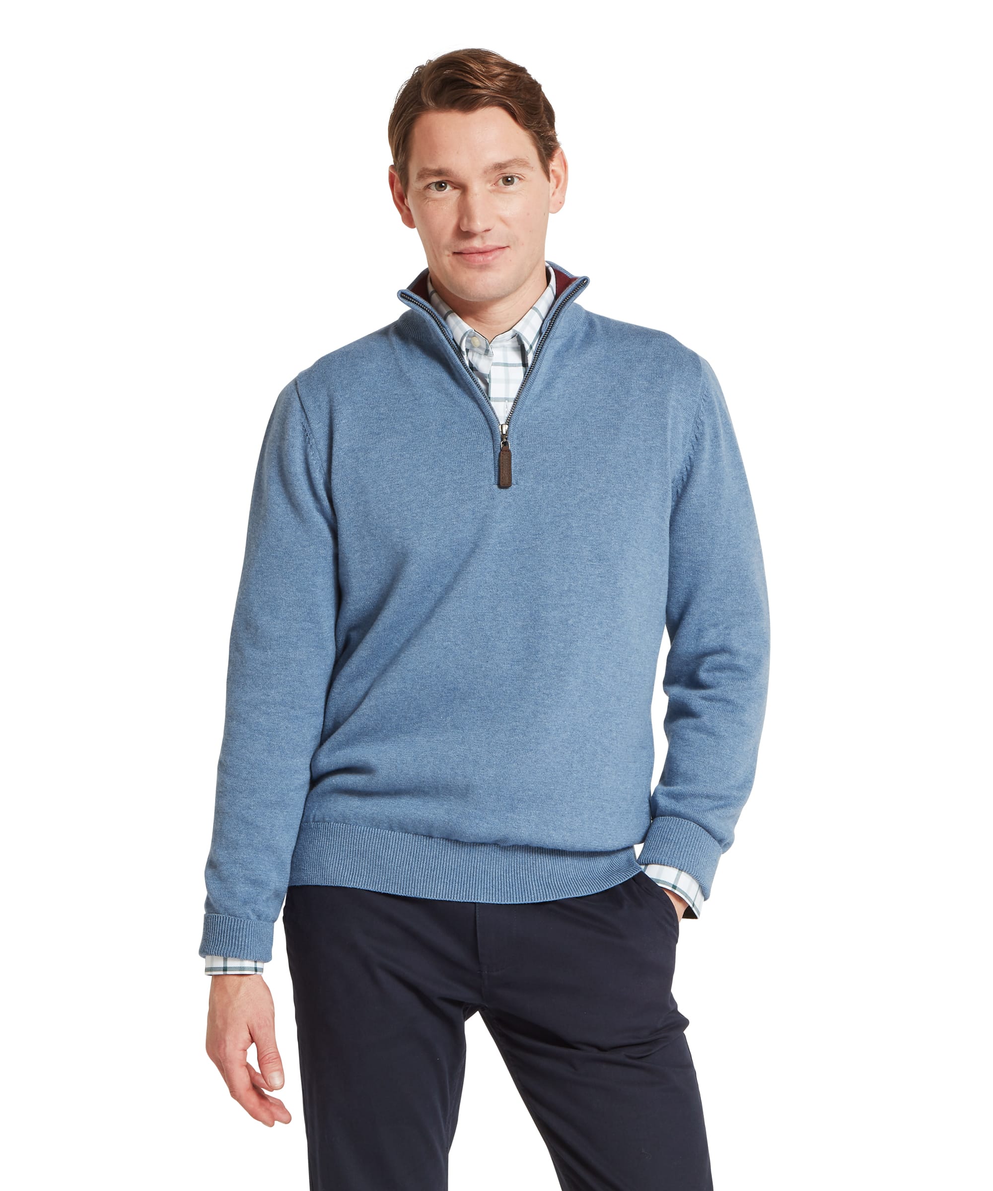 Schöffel Men's Calton Cotton Cashmere Quarter Zip Jumper in Blue - front view of a denim-blue marl cotton-cashmere quarter-zip with a funnel neck, leather zip pull, and ribbed hem, layered over a check shirt with navy chinos.