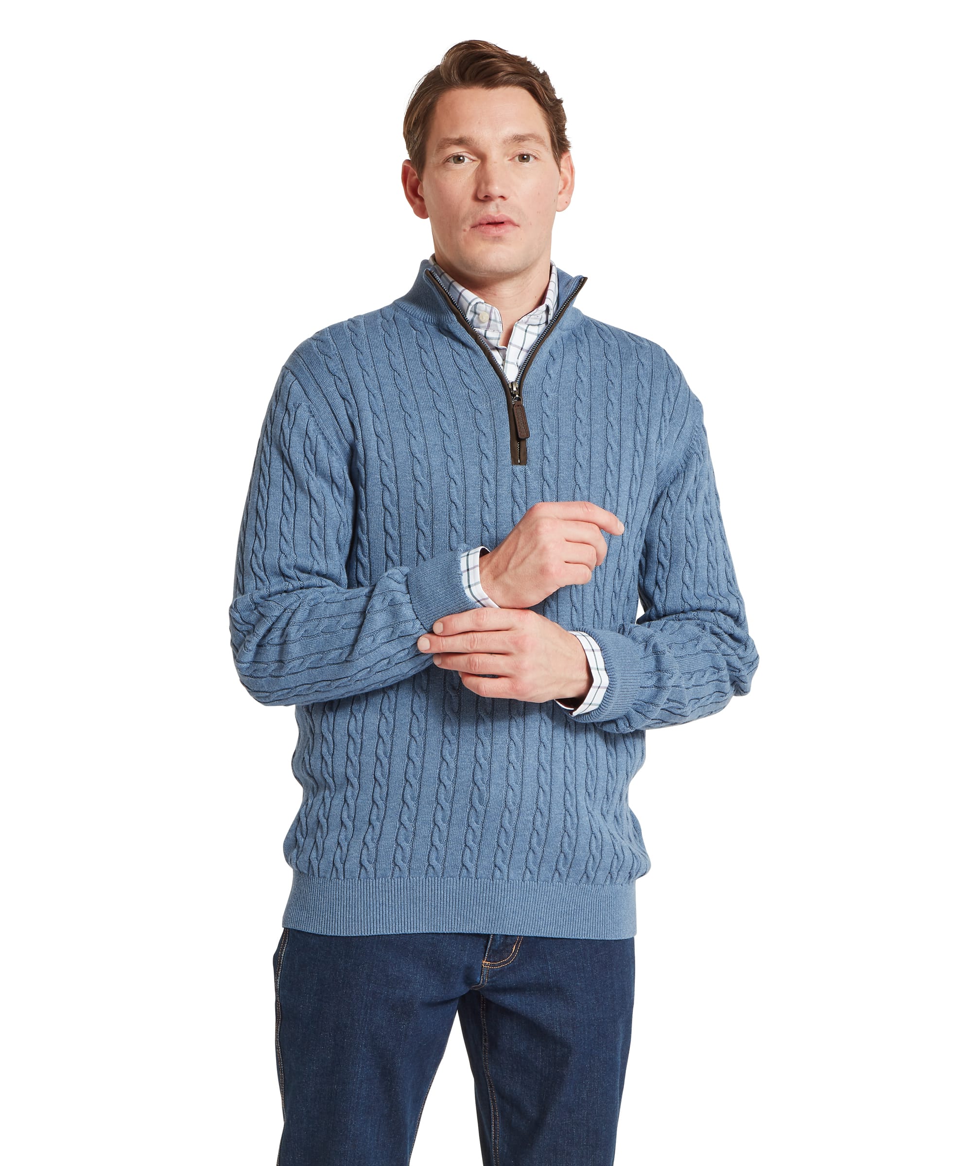 Schöffel Men's Calton Cotton Cashmere Cable 1/4 Zip Jumper in Blue — front view showing cable-knit body and quarter-zip neckline, styled with a check shirt and dark jeans