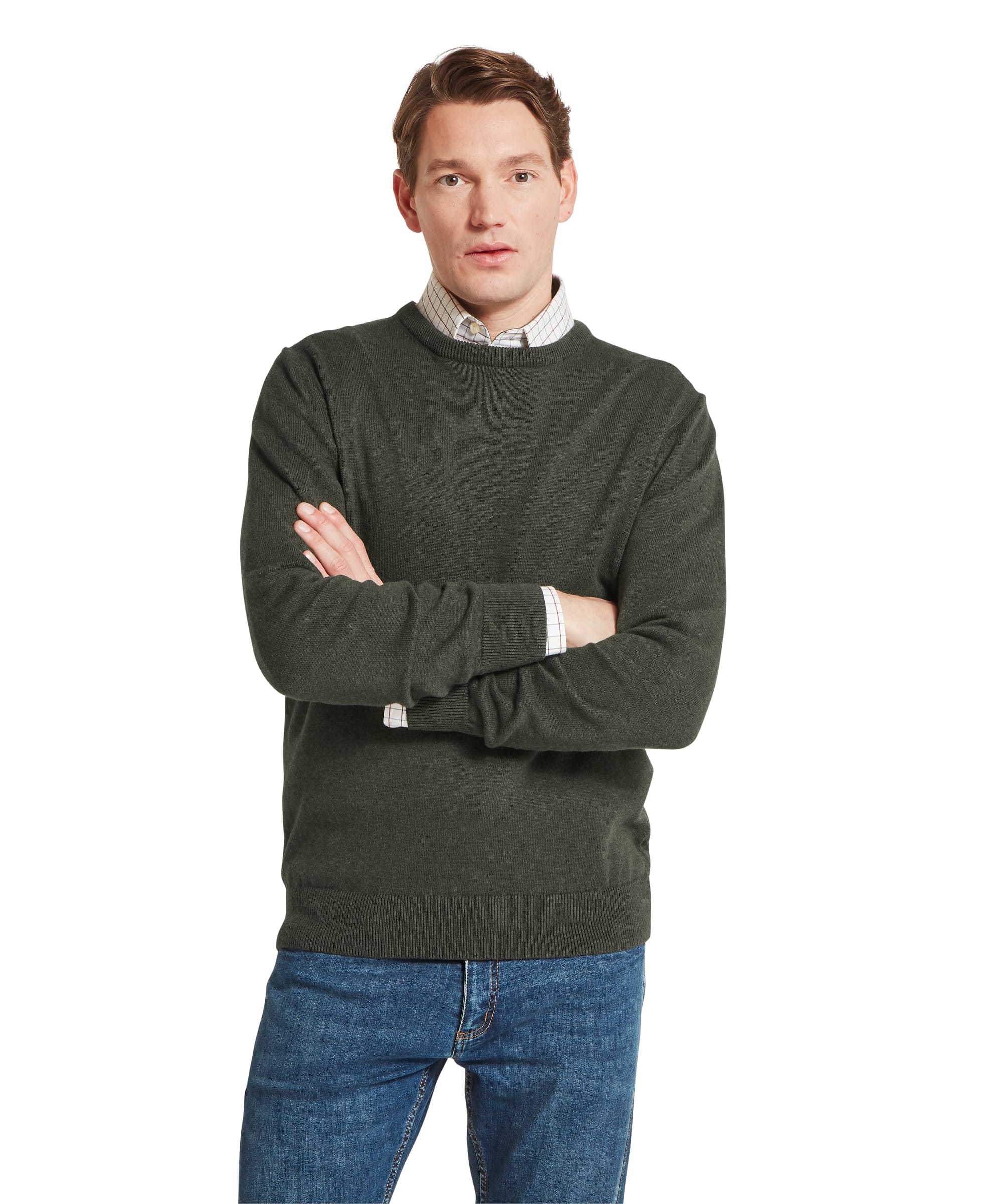 Schöffel Men's Calton Cotton Cashmere Crew Jumper in Green — front view with arms crossed, showing ribbed crew neck and smooth knit finish layered over a check shirt