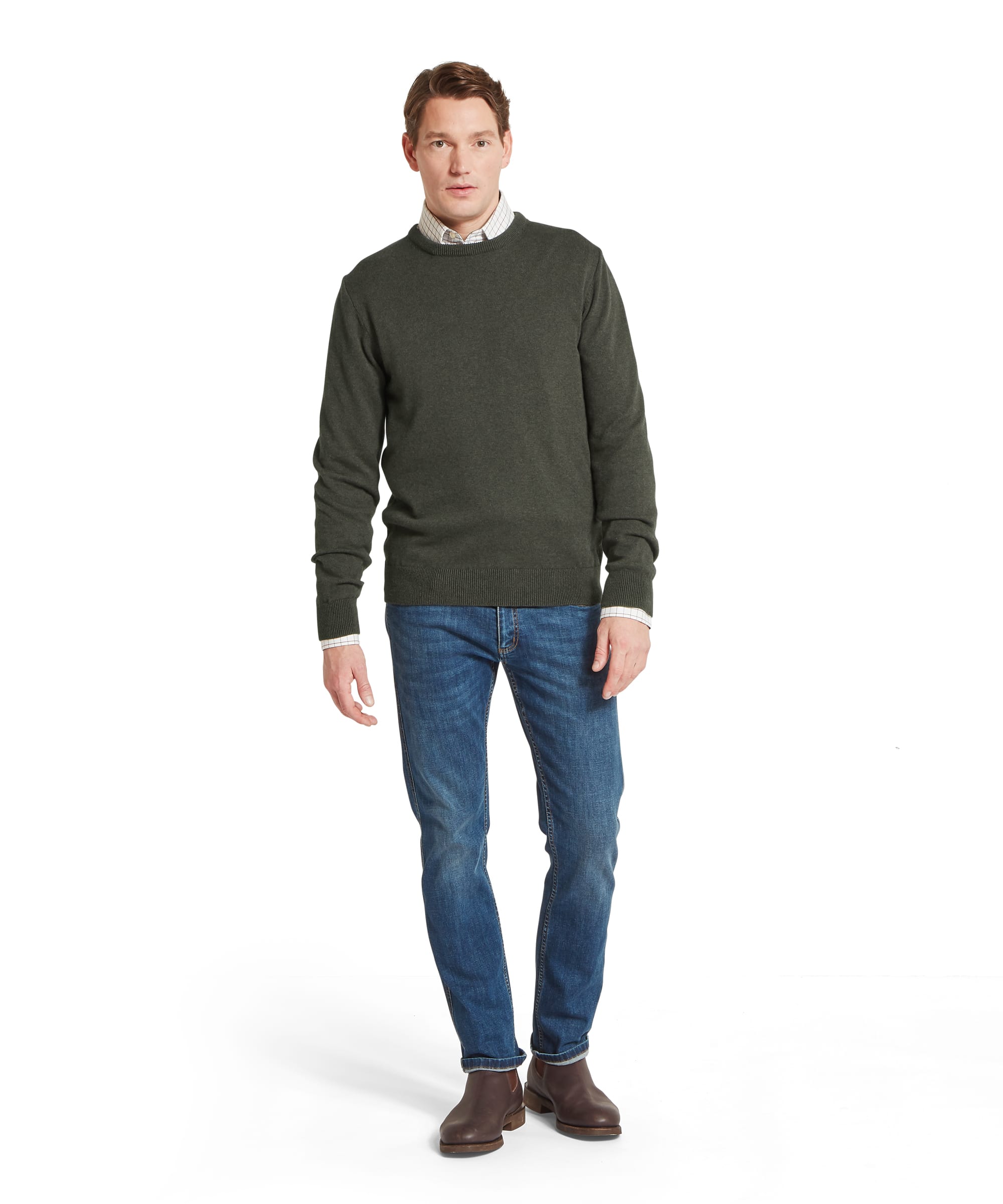 Schöffel Men's Calton Cotton Cashmere Crew Jumper in Green — full-length front view styled with blue jeans, check shirt and brown Chelsea boots