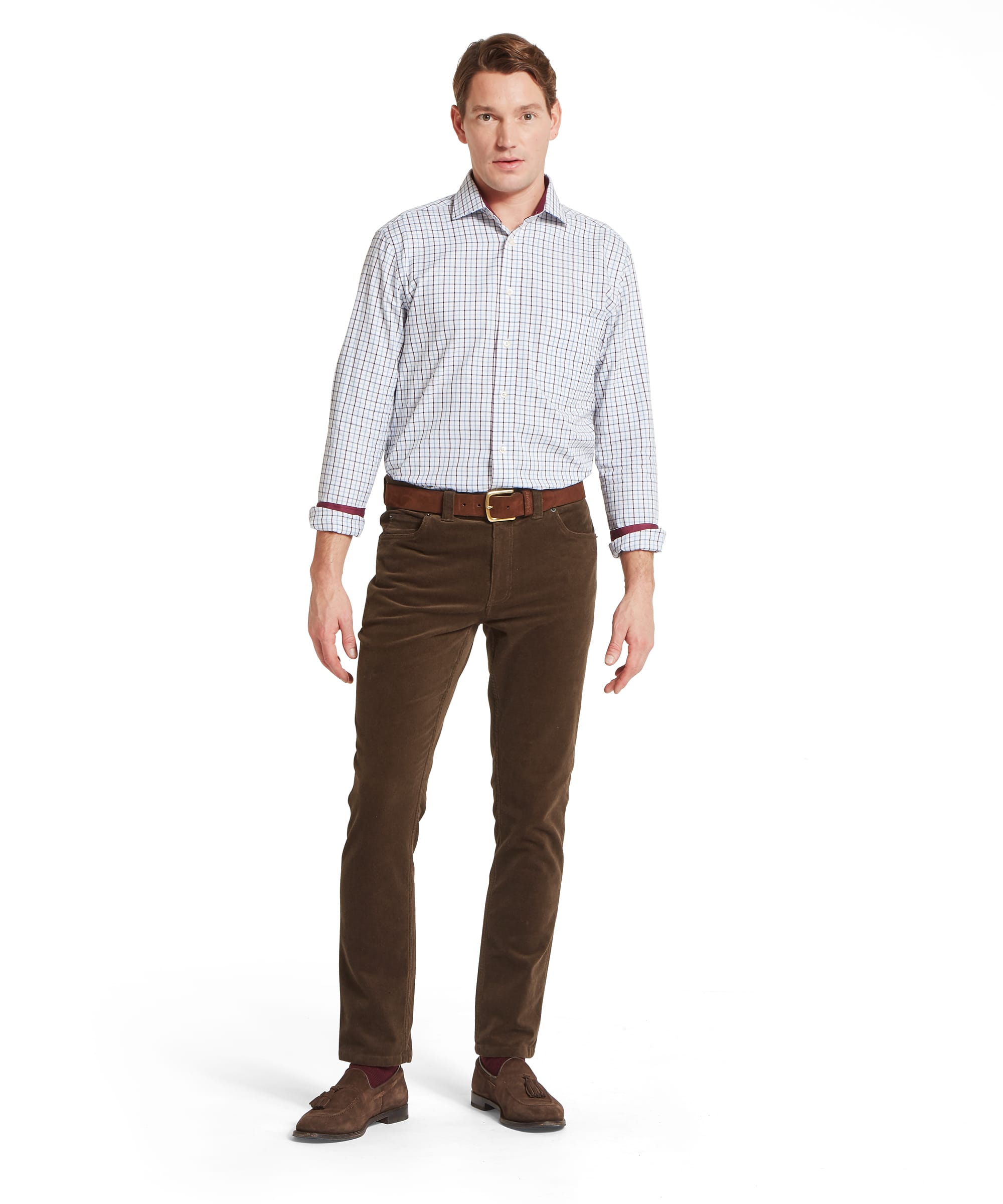 Schöffel Men's Camden Cord Trousers in Brown — full-length front view styled with a check shirt, leather belt and brown suede tassel loafers