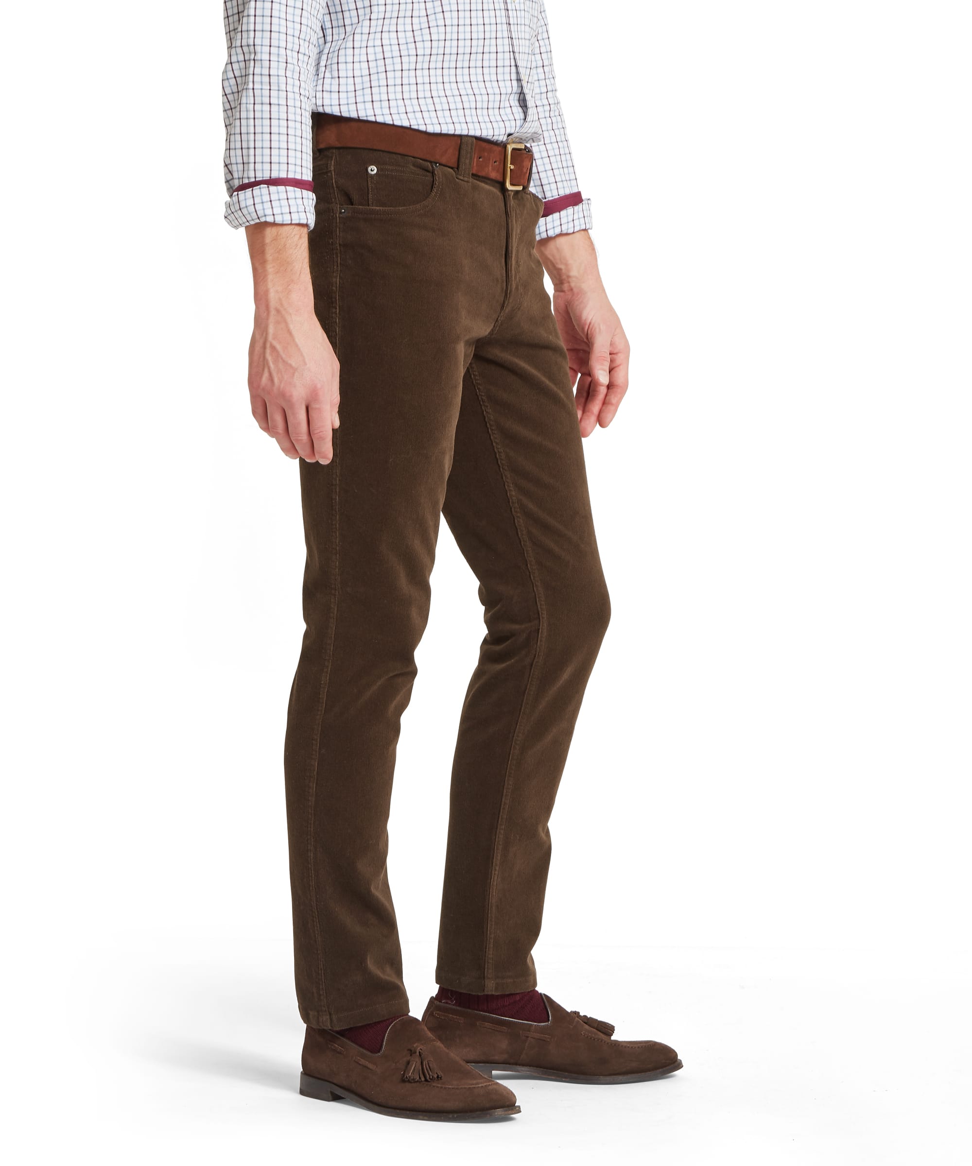 Schöffel Men's Camden Cord Trousers in Brown — side view showing fine-wale corduroy texture, leather belt and slim fit leg, styled with brown suede loafers