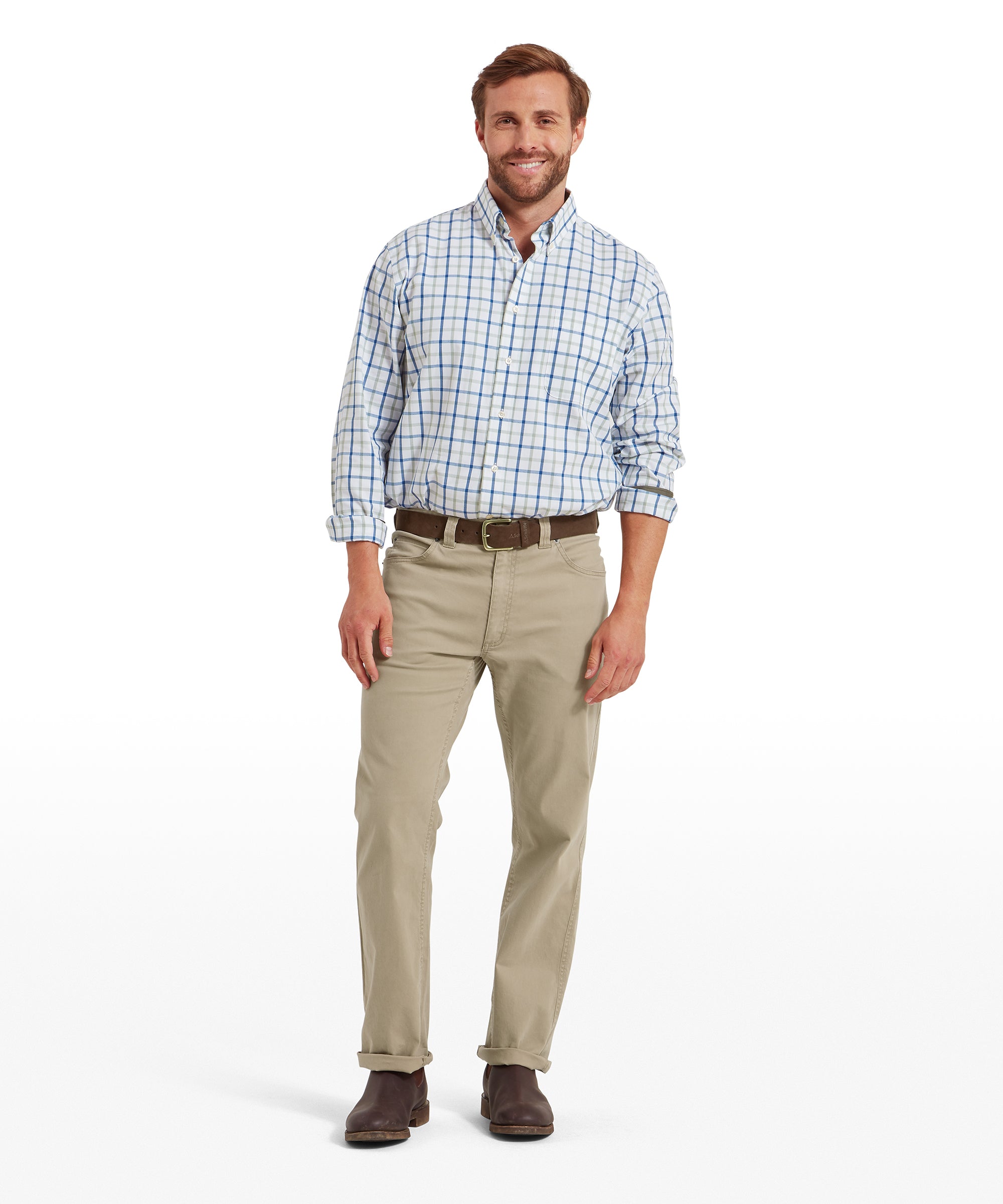 Man wearing a blue and white check shirt with rolled-up sleeves, tucked into camel-coloured jeans, styled with a brown belt and brown leather shoes. Outfit shown in a standing pose on a transparent background.