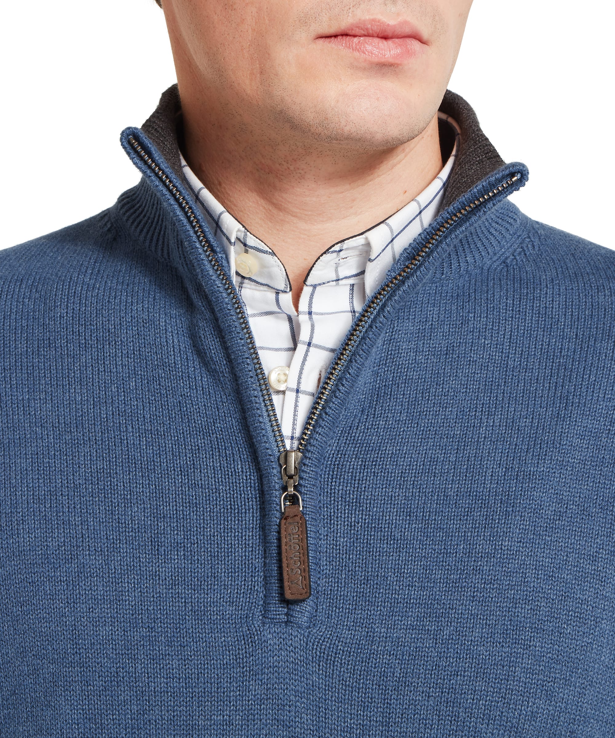Schöffel Men's Castlebay 1/4 Zip Jumper in Blue — close-up of the ribbed quarter-zip collar, leather-trimmed Schöffel branded zip pull and check shirt layered beneath