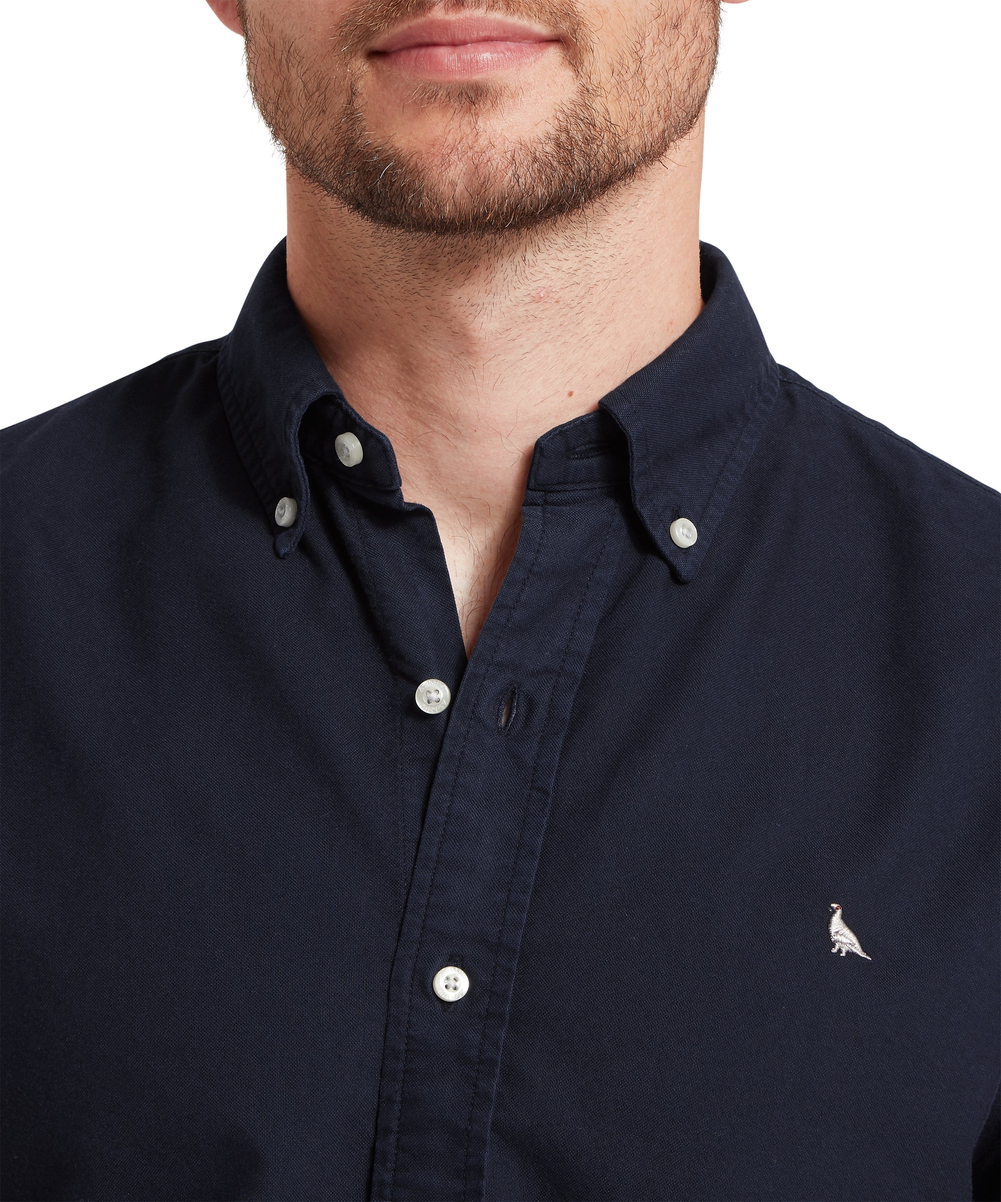 Navy blue button-up shirt with a small logo on a white background