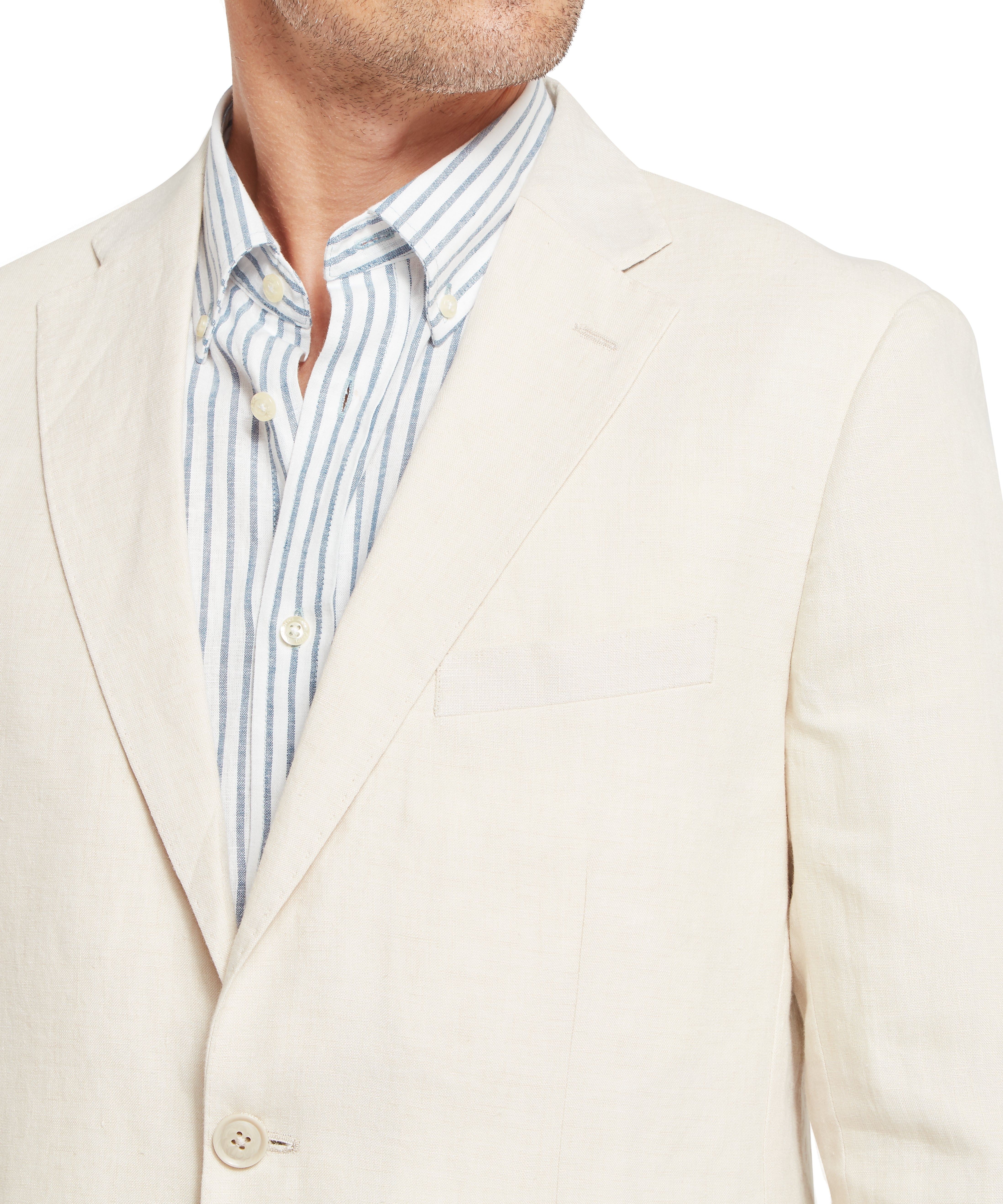 Man wearing a cream textured blazer over a blue and white vertically striped button-down shirt. The blazer features a notch lapel, a single visible button, and a chest pocket. The shirt is partially unbuttoned at the top, revealing the neckline. The look is smart-casual, suitable for professional or social settings.
