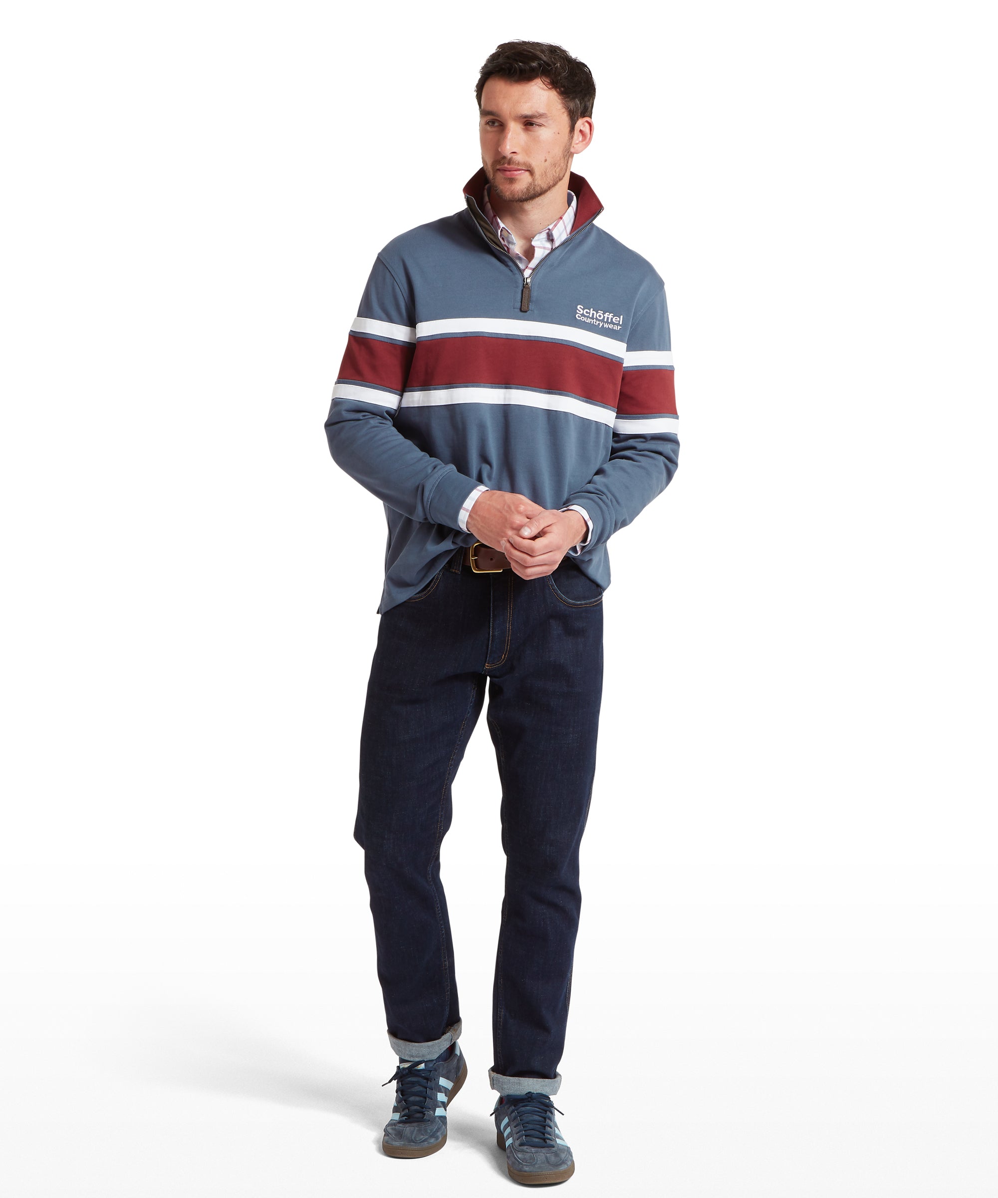 Man wearing a blue striped sweatshirt with red and white stripes on a white background