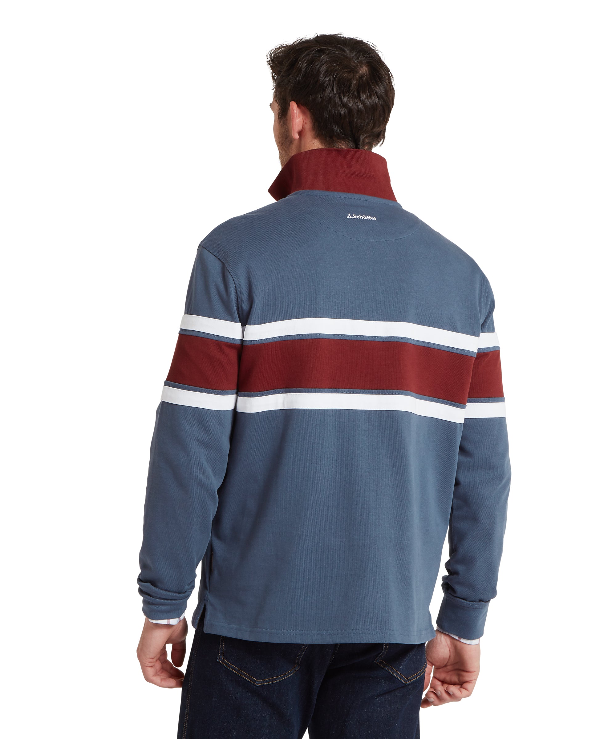 Man wearing a blue sweatshirt with red and white stripes on a white background