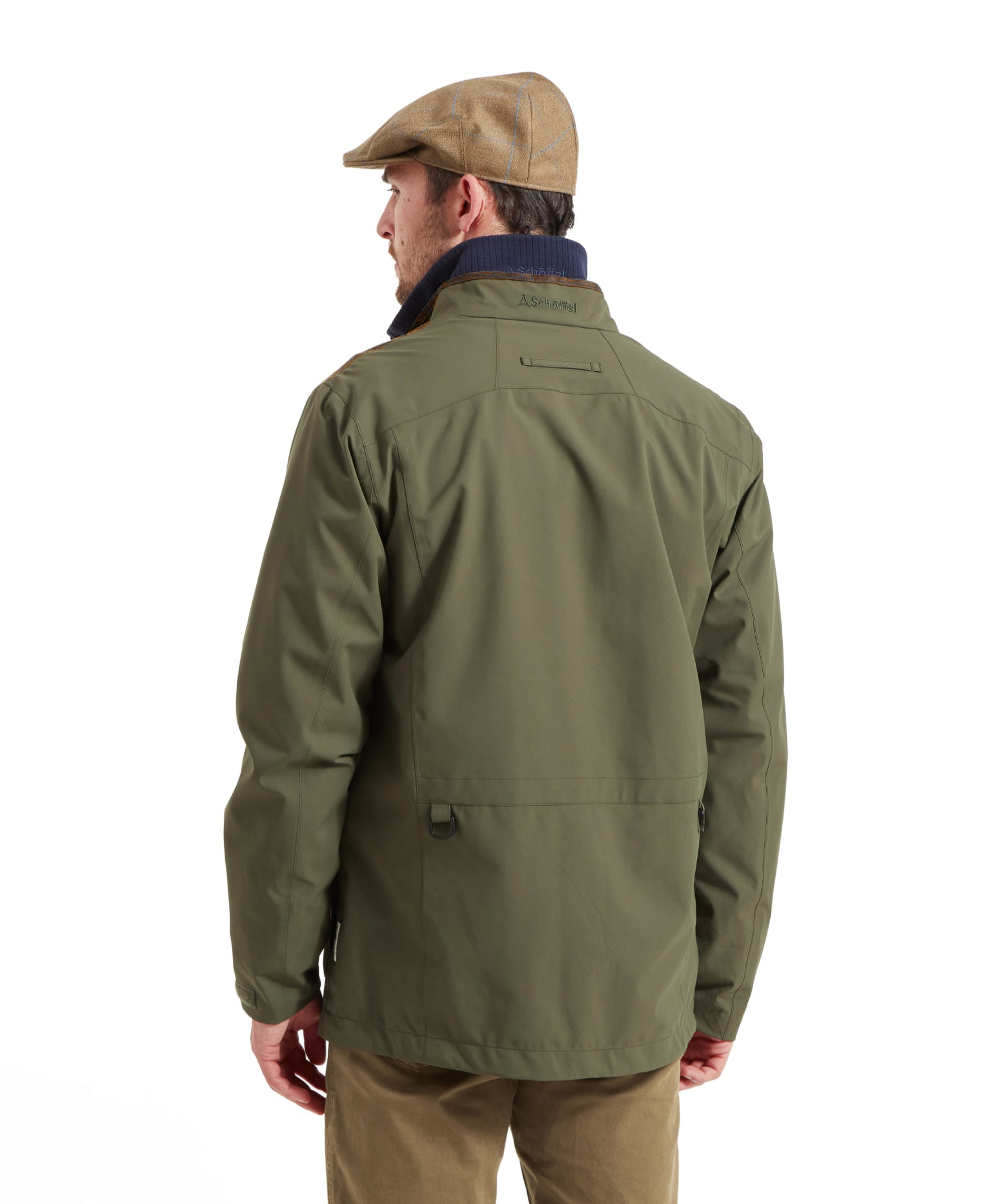 Man wearing the Schöffel Grimsthorpe Clay Shooting Jacket in Green with a tweed flat cap, back view detail.