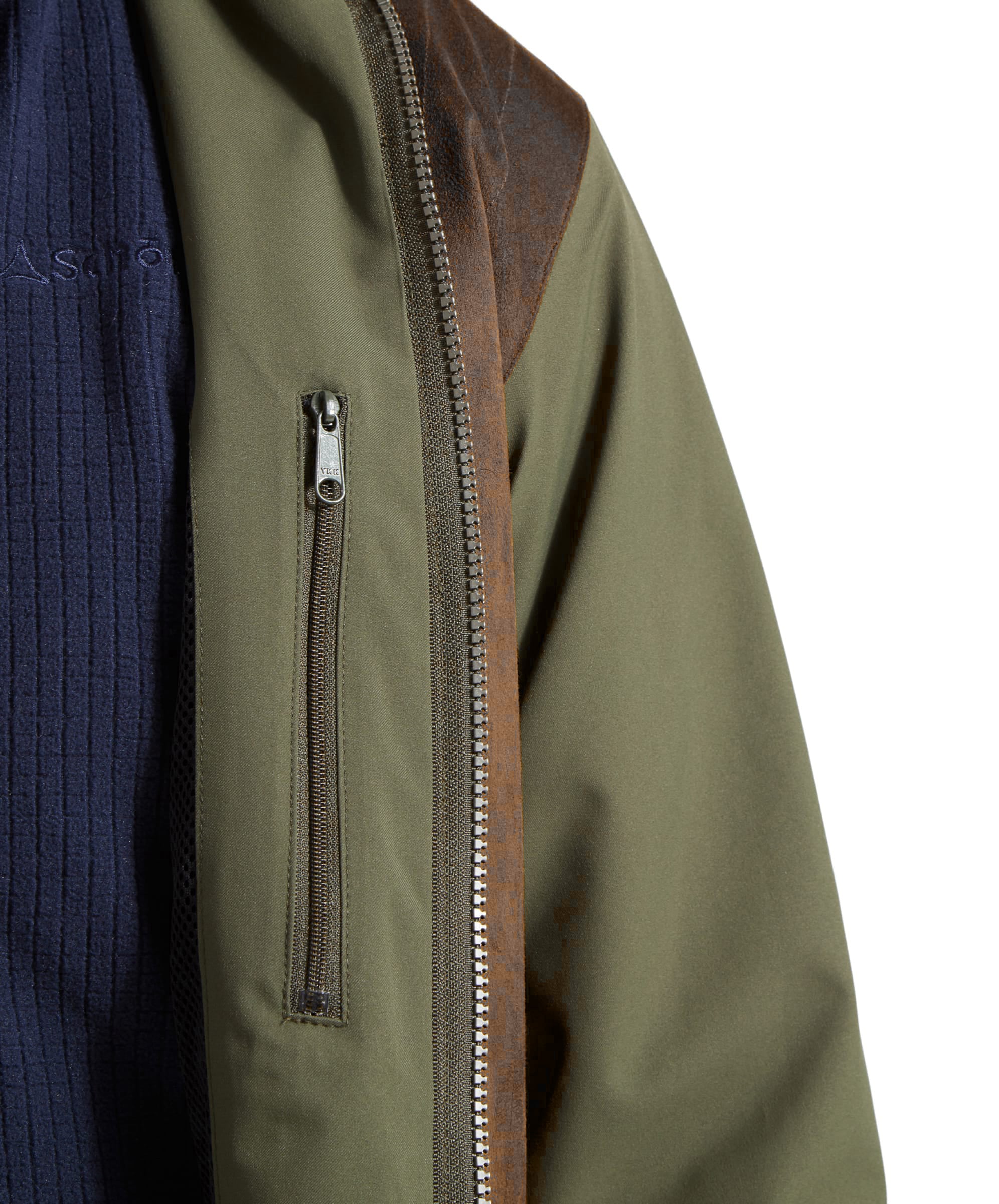 Close-up of the Schöffel Grimsthorpe Clay Shooting Jacket in Green, showing the two-way zip and adjustable cuff.