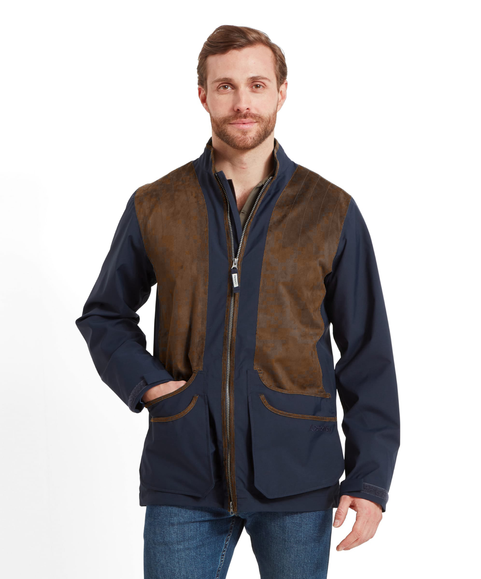 Man wearing the Schöffel Grimsthorpe Clay Shooting Jacket in Navy, front view with hands in pocket, styled with denim jeans.