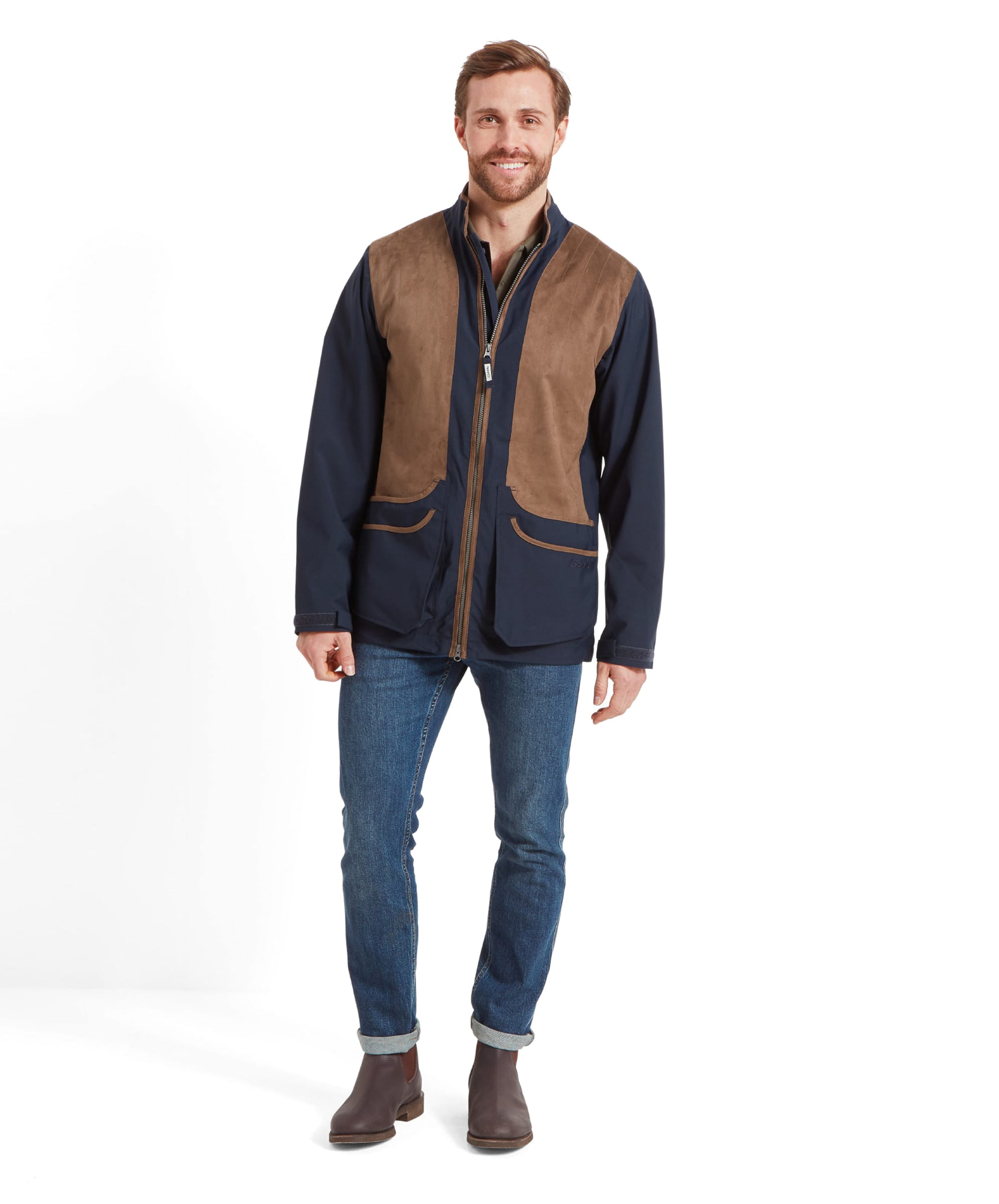 Schöffel Men's Grimsthorpe Clay Shooting Jacket in Blue — full-length front view styled with dark jeans and brown Chelsea boots