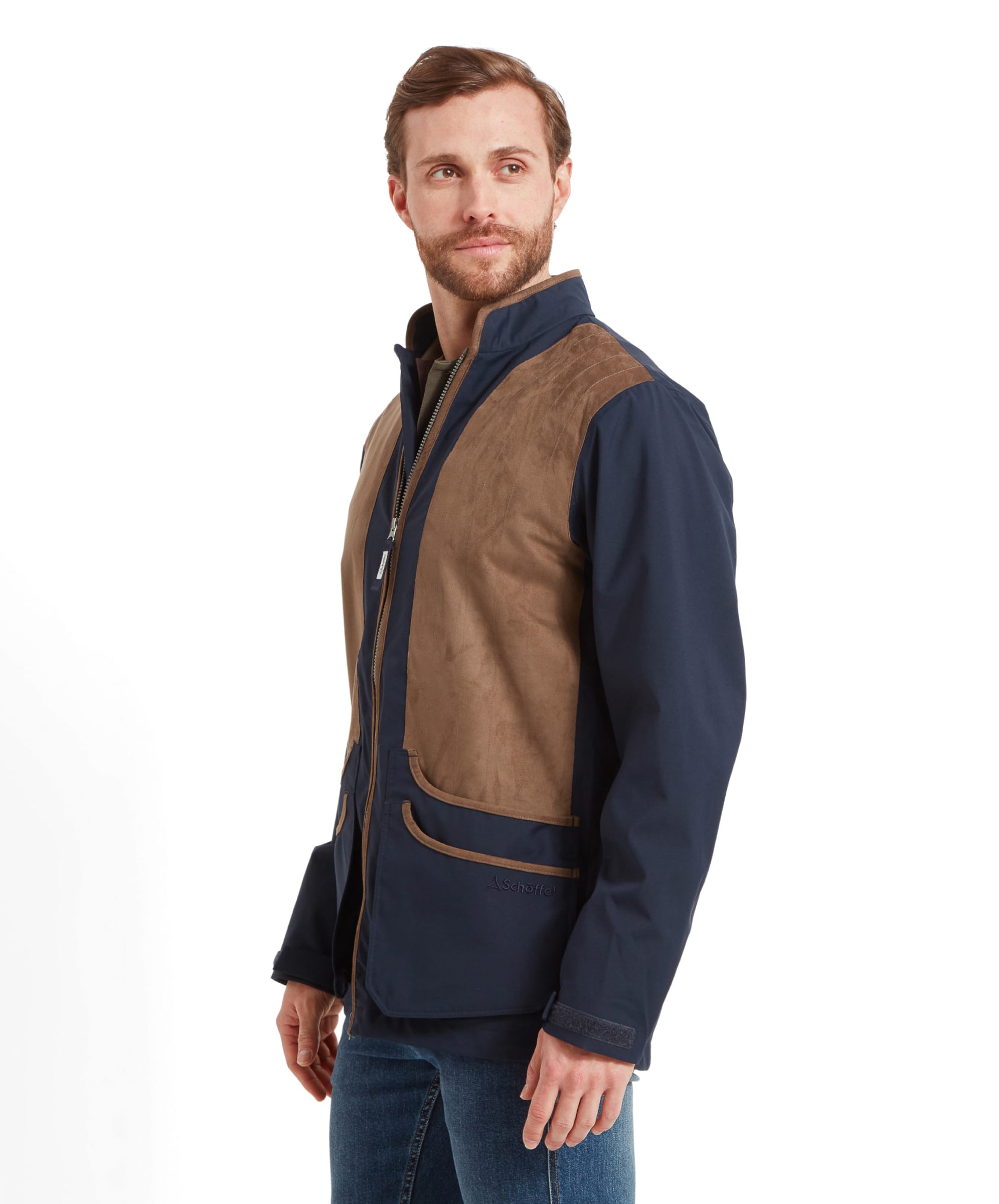 Schöffel Men's Grimsthorpe Clay Shooting Jacket in Blue — three-quarter side view showing contrast suede shooting patches, cartridge pockets with suede trim and layered knitwear collar