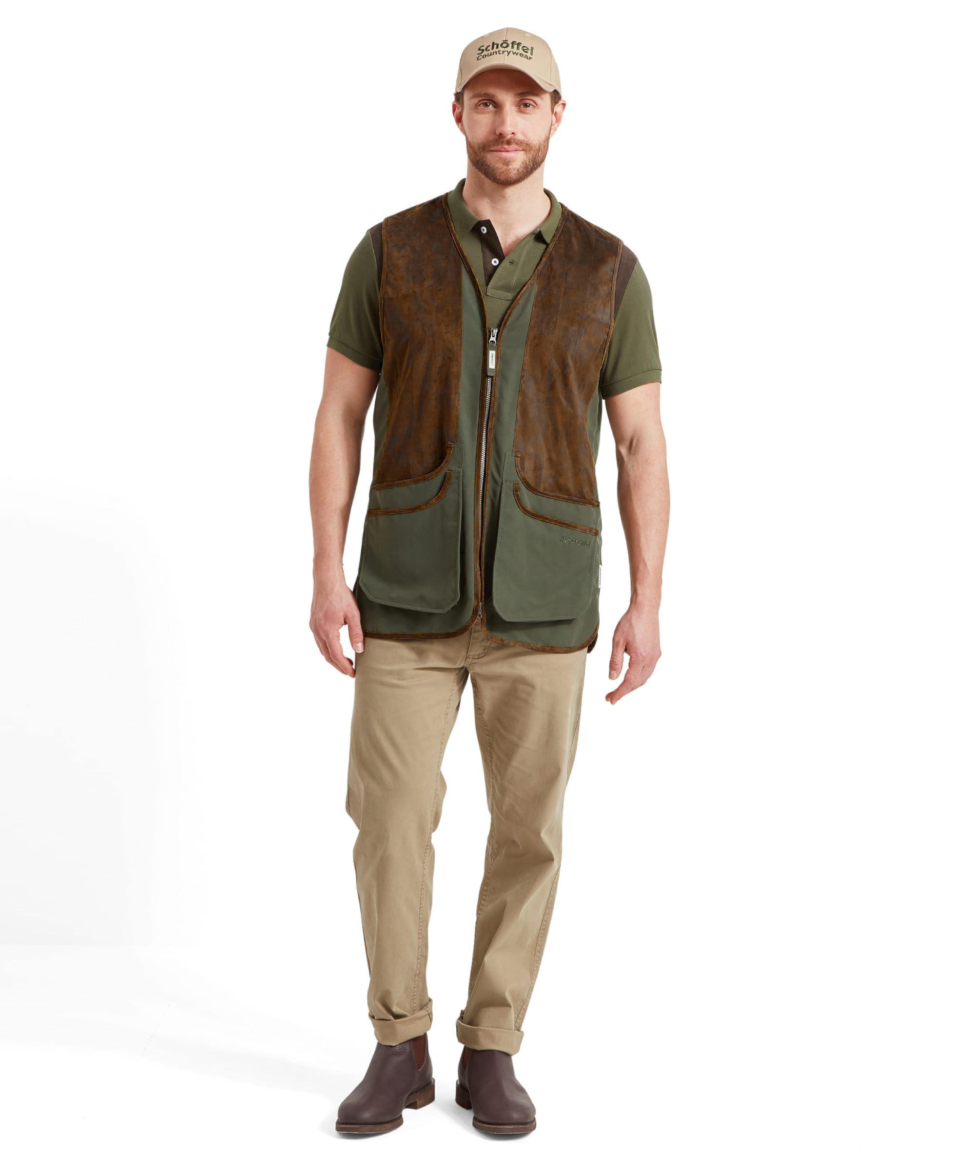 Man wearing the Schöffel Grimsthorpe Clay Shooting Vest in Green with a branded cap, front view styled with a polo shirt and chinos.