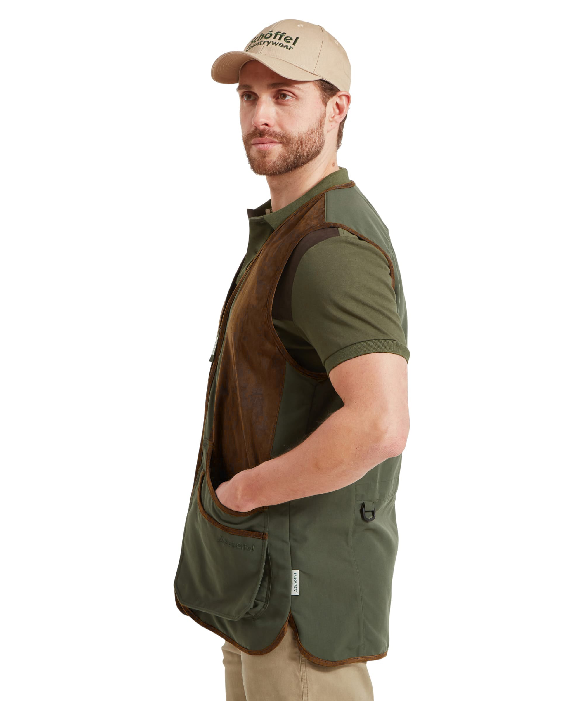 Man wearing the Schöffel Grimsthorpe Clay Shooting Vest in Green with a branded cap, side view showing the leather-look shoulder patch.