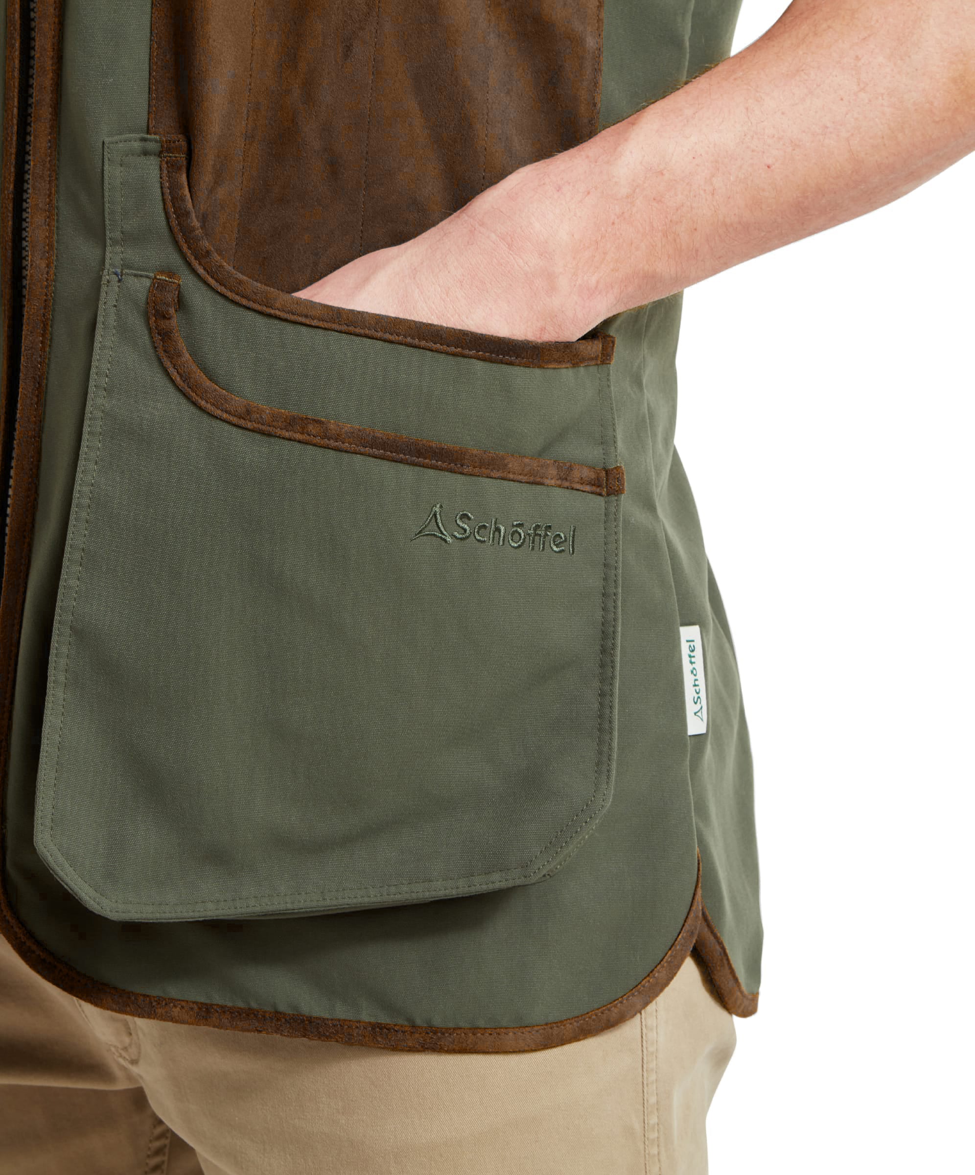 Close-up of the Schöffel Grimsthorpe Clay Shooting Vest in Green, showing the cartridge pocket with embroidered branding.