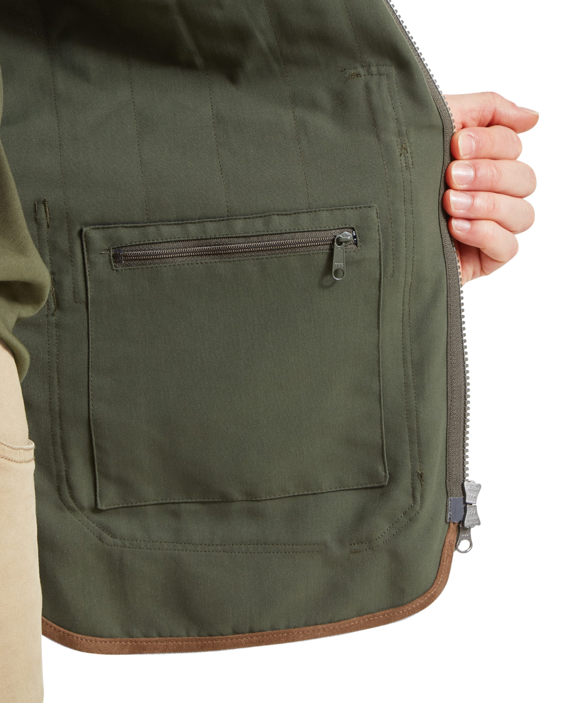 Schöffel Men's Grimsthorpe Clay Shooting Vest in Green — close-up of interior showing zip-secure inner pocket, quilted lining and suede-trimmed hem detail